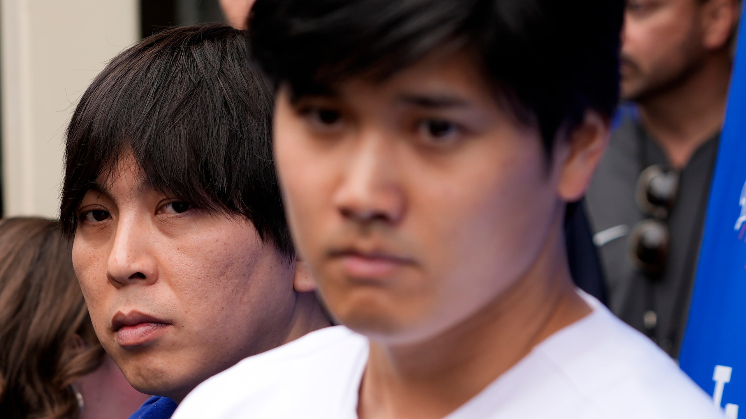 FILE - Ippei Mizuhara stands next to Japanese baseball star Shohei Ohtani and translates during an interview at Dodger Stadium on Feb. 3, 2024. The firing of Ohtani's interpreter by the Los Angeles Dodgers over allegations of illegal gambling has highlighted an issue many outside of California don't realize: Sports betting is still against the law in the nation's most populous state. (AP Photo/Richard Vogel, File)