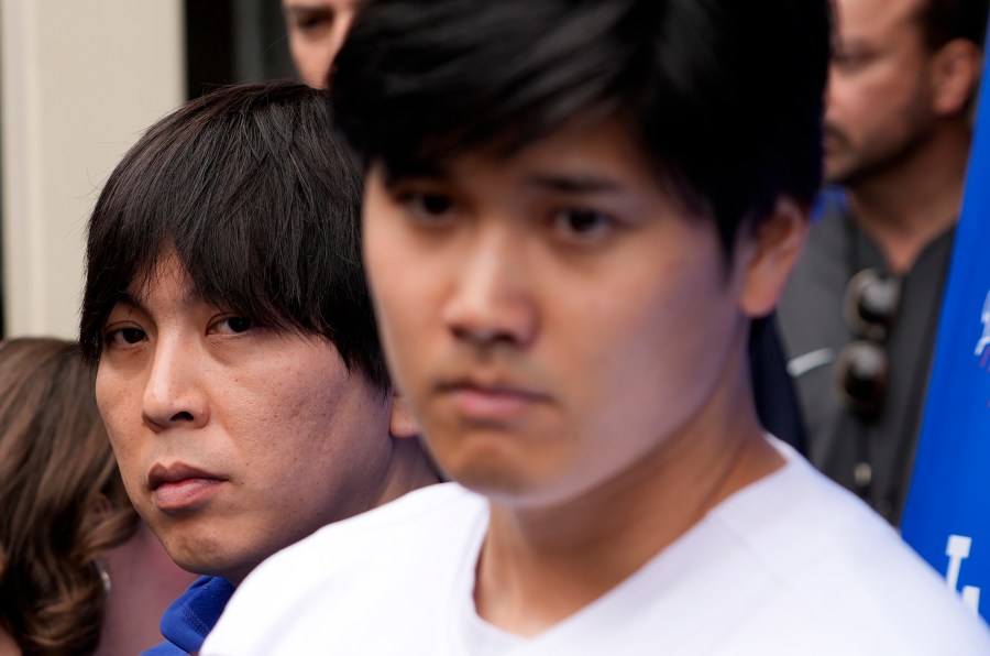 FILE - Ippei Mizuhara stands next to Japanese baseball star Shohei Ohtani and translates during an interview at Dodger Stadium on Feb. 3, 2024. The firing of Ohtani's interpreter by the Los Angeles Dodgers over allegations of illegal gambling has highlighted an issue many outside of California don't realize: Sports betting is still against the law in the nation's most populous state. (AP Photo/Richard Vogel, File)