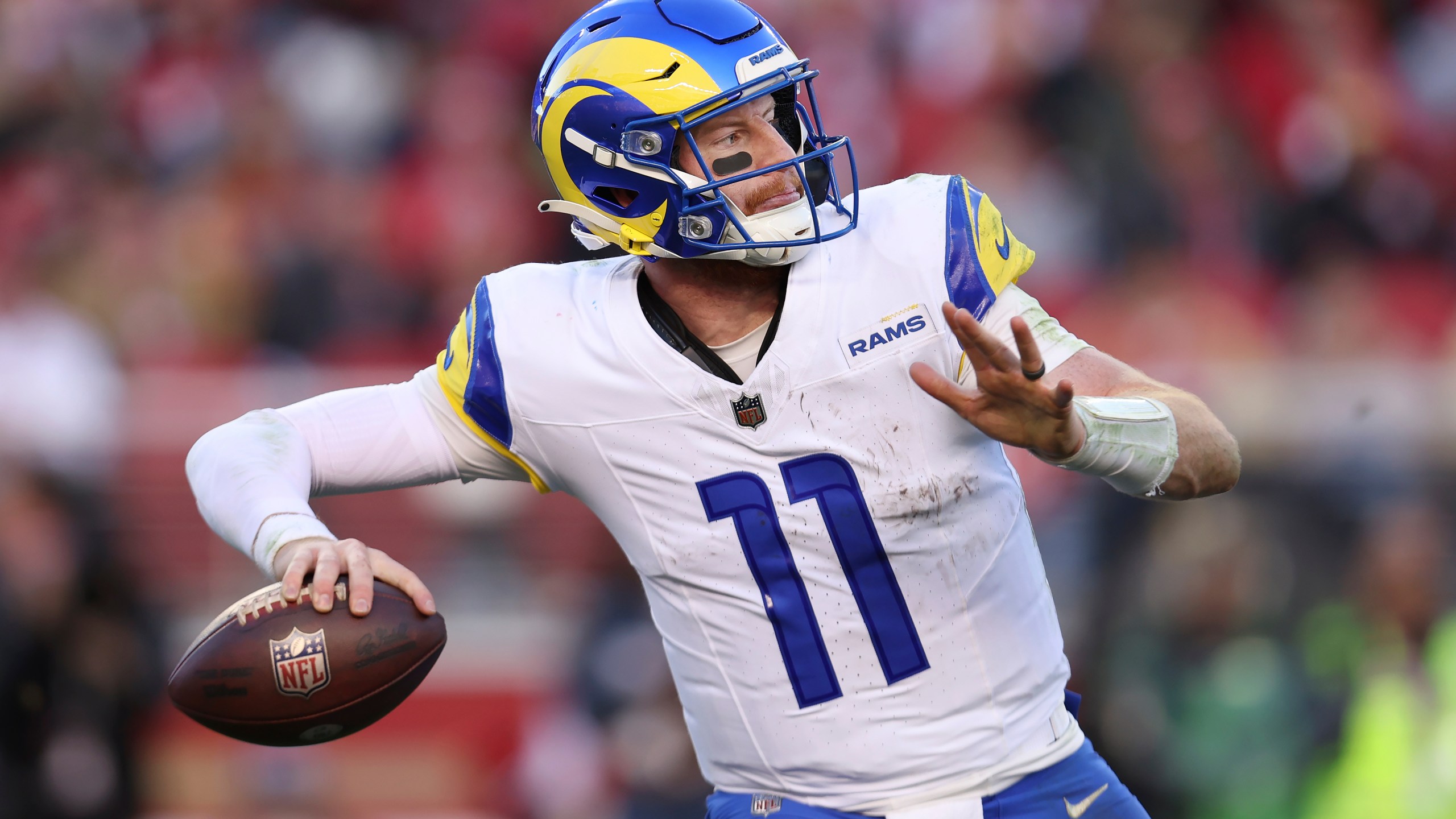 FILE - Los Angeles Rams quarterback Carson Wentz (11) passes against the San Francisco 49ers during the second half of an NFL football game in Santa Clara, Calif., Sunday, Jan. 7, 2024. Carson Wentz has agreed to a one-year contract with the Kansas City Chiefs, a person familiar with the deal told The Associated Press on Tuesday, April 2, 2024. (AP Photo/Jed Jacobsohn, File)