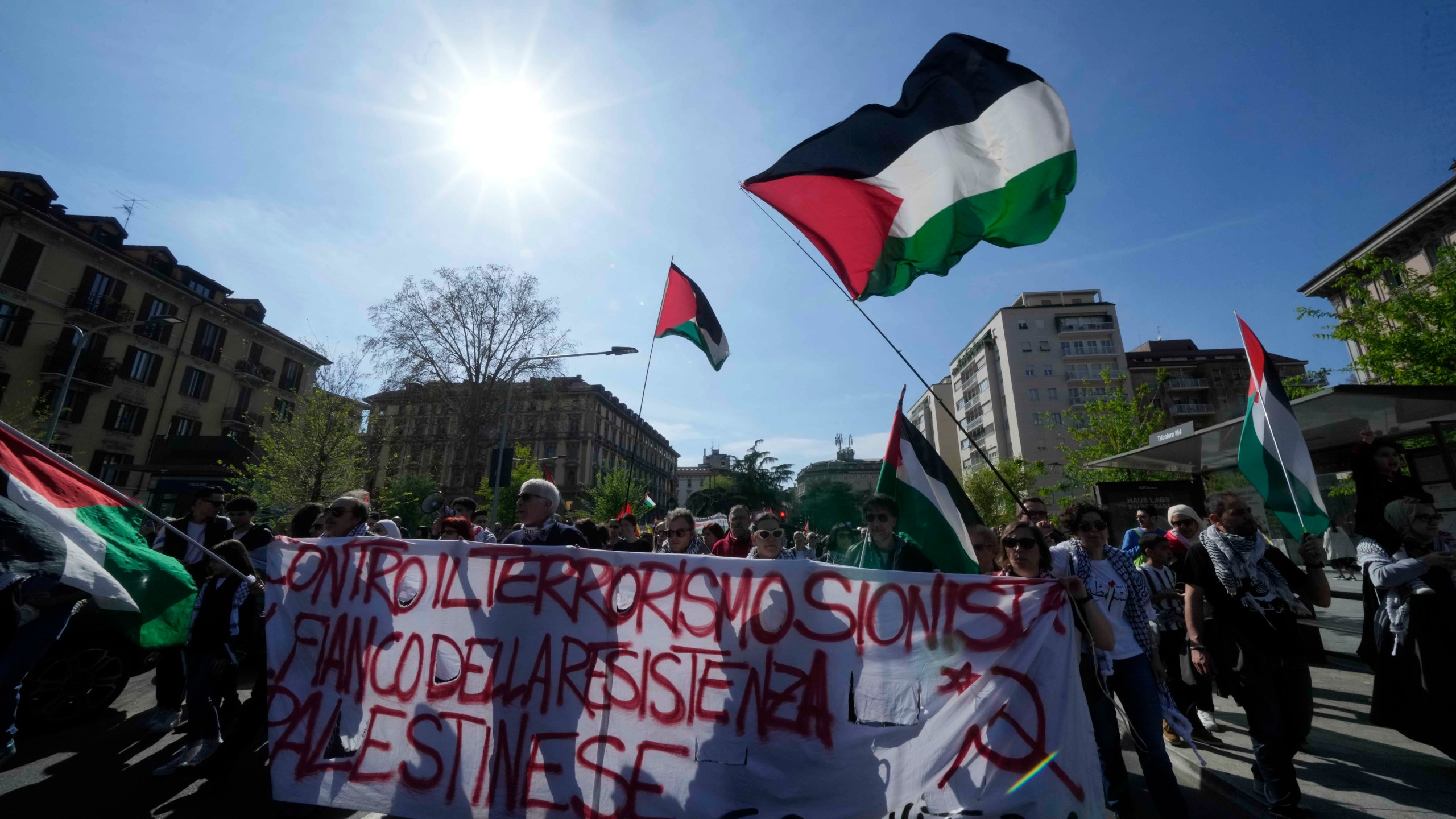 Demonstrators participate in a solidarity rally for Palestinians in Gaza, in Milan, Italy, Saturday, April 6, 2024. (AP Photo/Luca Bruno)