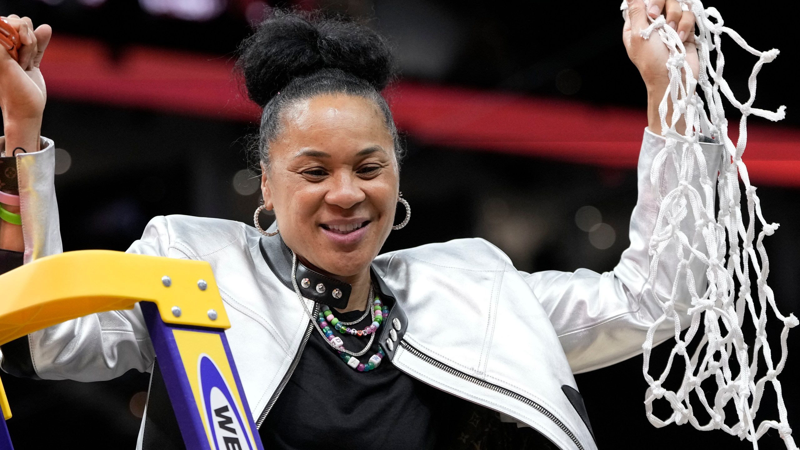 South Carolina head coach Dawn Staley cuts down the net after the Final Four college basketball championship game against Iowa in the women's NCAA Tournament, Sunday, April 7, 2024, in Cleveland. South Carolina won 87-75. (AP Photo/Morry Gash)