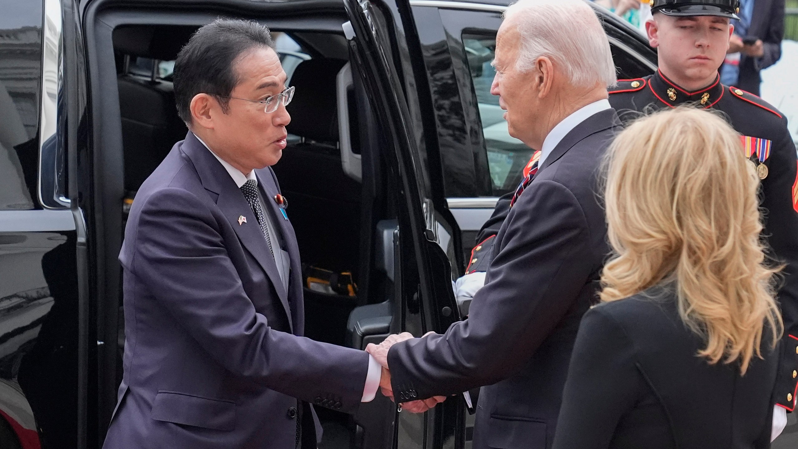 President Joe Biden, center, and first lady Jill Biden greet Japanese Prime Minister Fumio Kishida, left, upon his arrival at the White House, Tuesday, April 9, 2024, in Washington. (AP Photo/Alex Brandon)