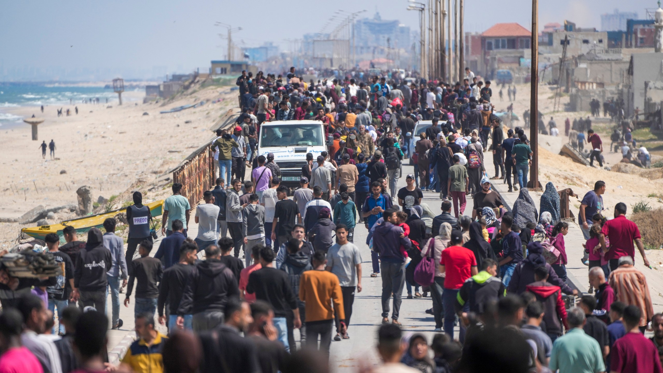 Displaced Palestinians trying to walk back from central Gaza Strip to northern Gaza Strip , Sunday, April 14, 2024. (AP Photo/Abdel Kareem Hana)