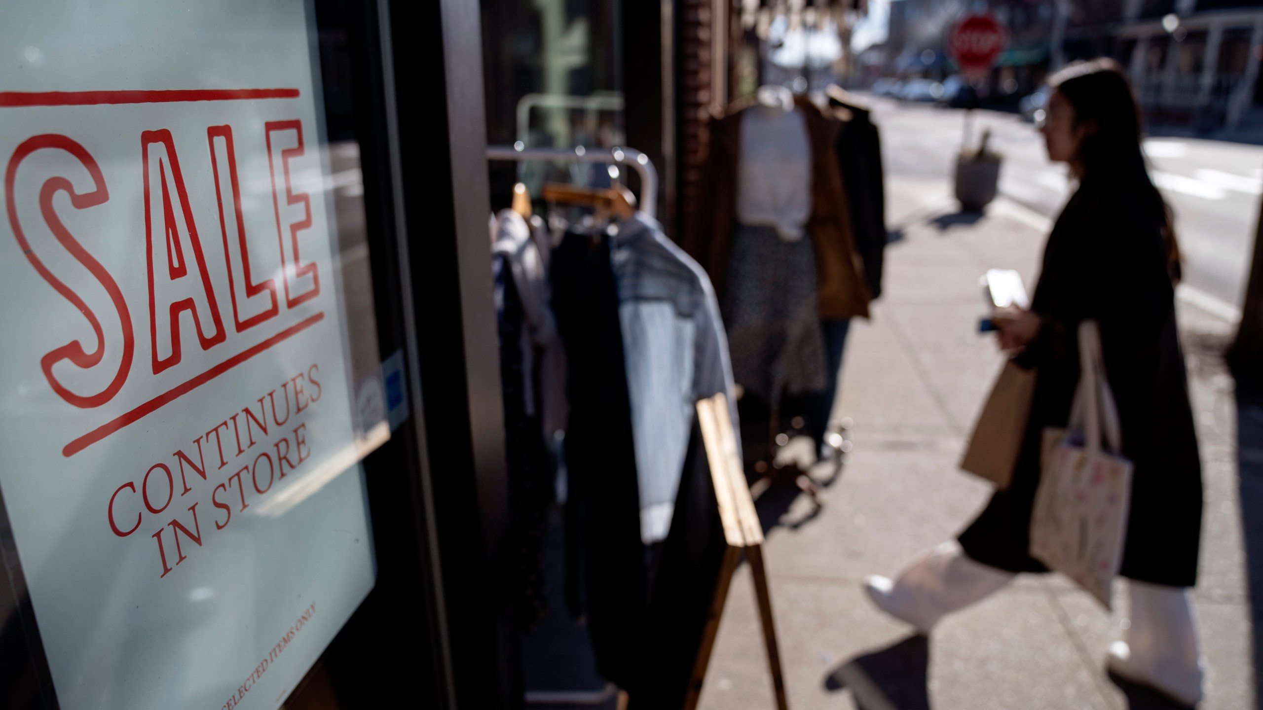 FILE - A shop holds a sidewalk sale on Feb. 10, 2023, in Providence, R.I. Record numbers of people are starting new businesses, and more and more of them are women and minorities, according to a new study.(AP Photo/David Goldman, File)