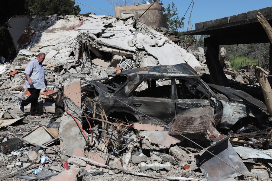 A Lebanese man checks a destroyed house that was hit by an Israeli airstrike, in Alma al-Shaab, a Lebanese border village with Israel, south Lebanon, Wednesday, April 17, 2024. Hezbollah militants and Israeli forces have been exchanging fire since a day after the Israel-Hamas war began on Oct. 7. (AP Photo/Mohammed Zaatari)