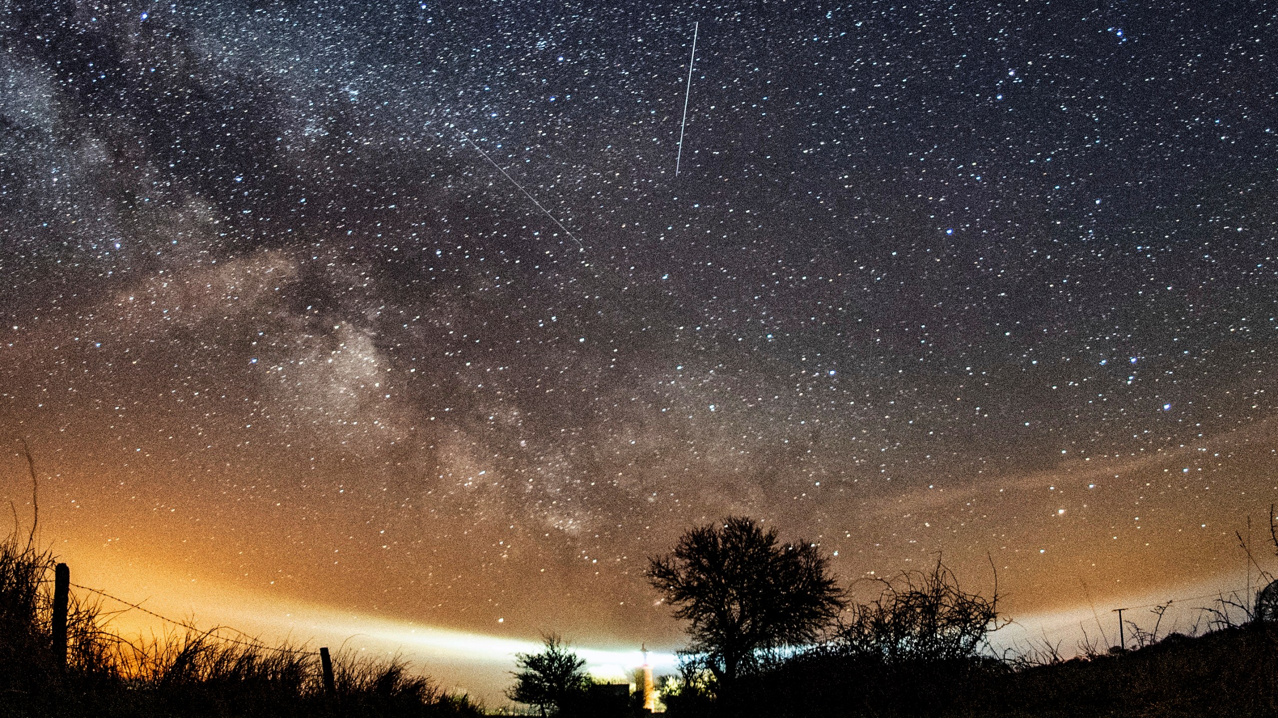 FILE - The Lyrid meteor shower is seen over Burg on the Baltic Sea island of Fehmarn off Germany, Friday, April 20, 2018. The Lyrids occur every year in mid-to-late April. Peak activity for 2024 happens Sunday, April 21 into Monday, April 22, with 10 to 20 meteors expected per hour, weather permitting. Viewing lasts through April 29. (Daniel Reinhardt/dpa via AP, File)