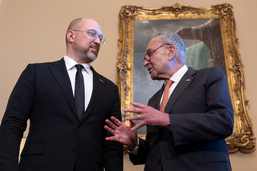 Ukraine's Prime Minister Denys Shmyhal, left, is welcomed by Senate Majority Leader Chuck Schumer, D-N.Y., as Congress moves to advance an emergency aid package for Israel, Ukraine and Taiwan, at the Capitol in Washington, Thursday, April 18, 2024. (AP Photo/J. Scott Applewhite)