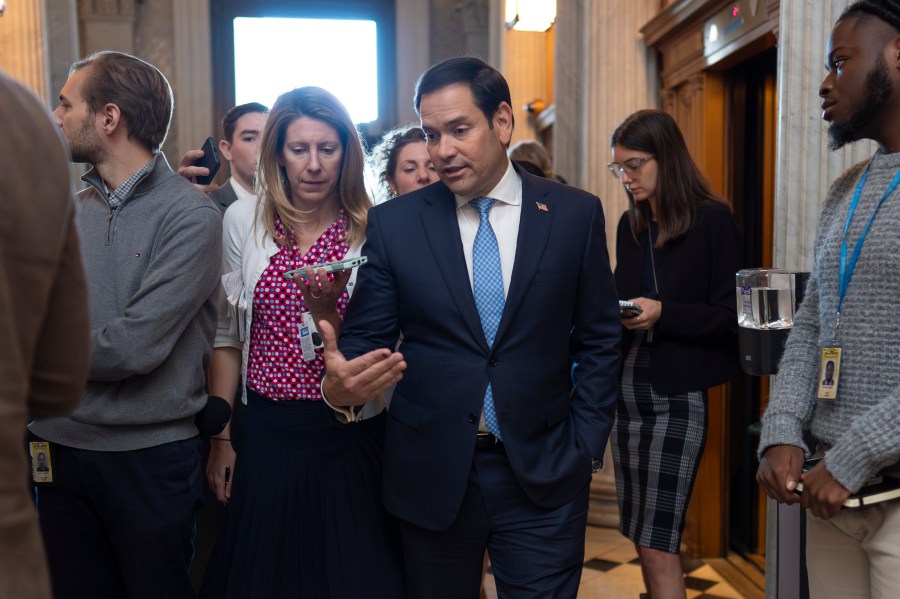 Sen. Marco Rubio, R-Fla., speaks with a reporter as the Senate prepares to advance the $95 billion aid package for Ukraine, Israel and Taiwan passed by the House, at the Capitol in Washington, Tuesday, April 23, 2024. (AP Photo/J. Scott Applewhite)