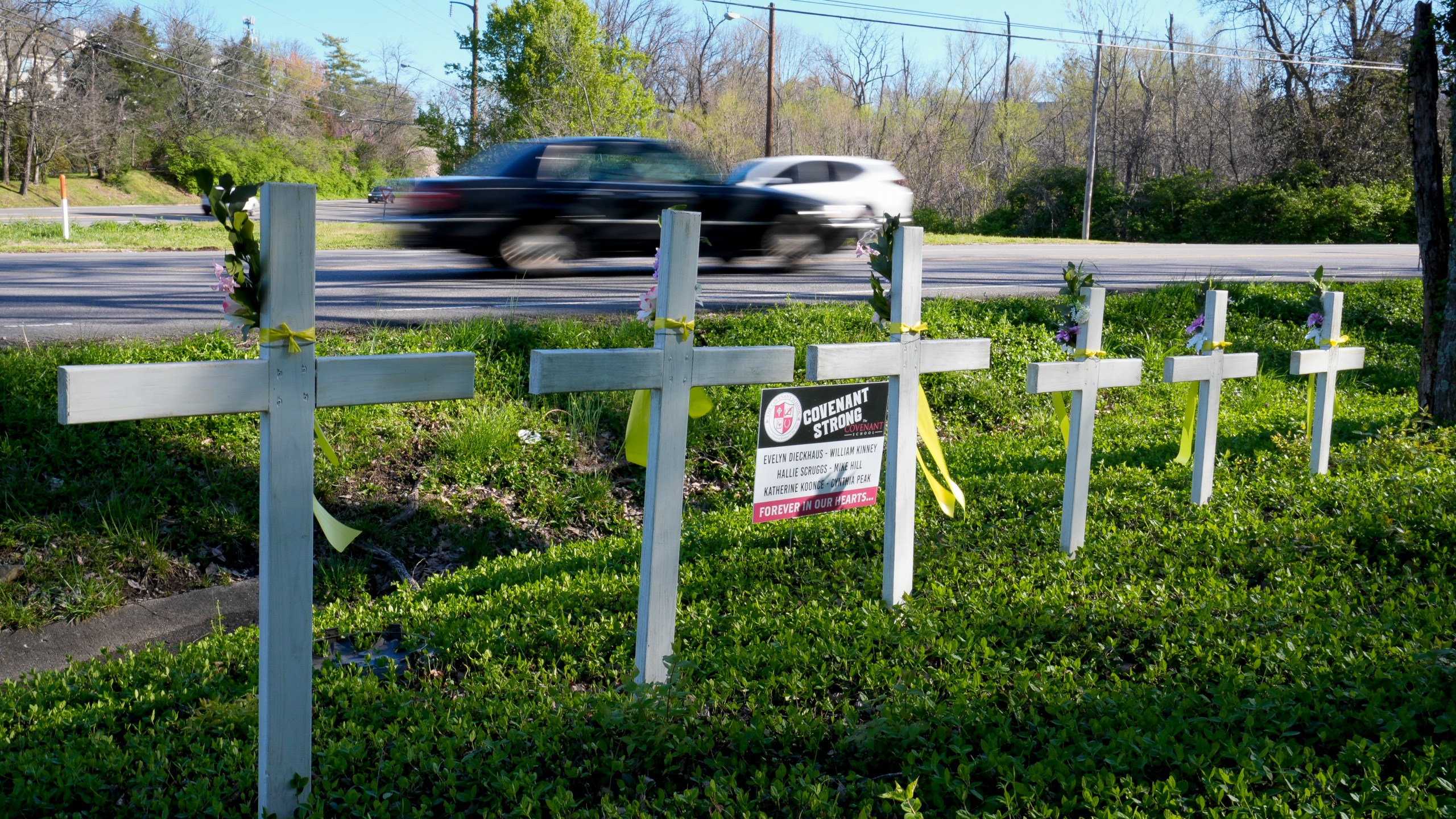 FILE - A roadside memorial is stands near the Covenant School on the one-year anniversary of a mass shooting, March 27, 2024, in Nashville, Tenn. On Tuesday, April 23, the Republican-led Legislature in Tennessee gave final approval to legislation that would allow some public school teachers to carry concealed guns into the classroom, a year after the deadly school shooting in the state's capital city stirred impassioned debate about the best ways to curb such violence. (AP Photo/George Walker IV, File)