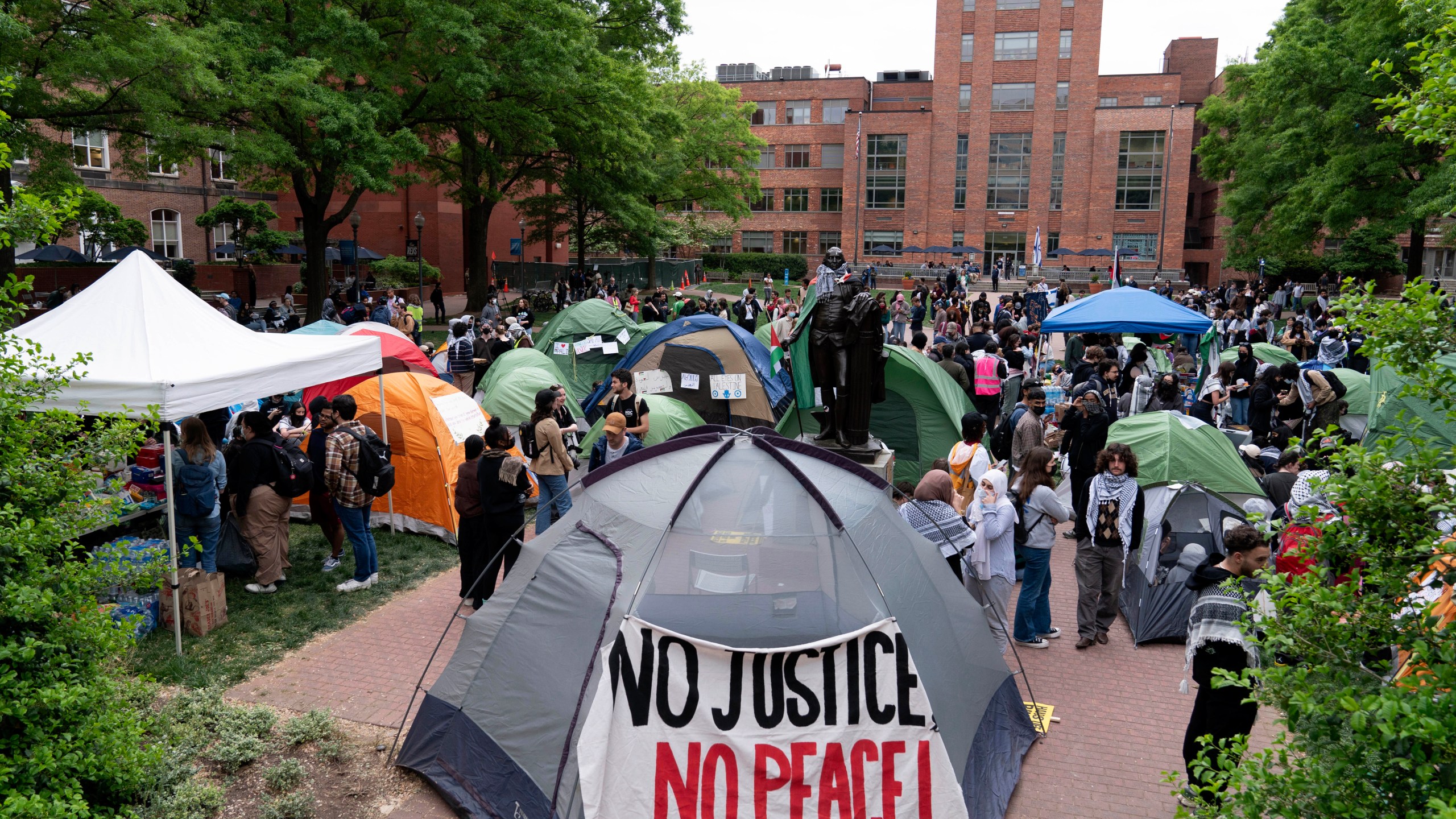 George Washington University students set tents in the campus during a pro-Palestinians protests over the Israel-Gaza War, Thursday, April 25, 2024, in Washington. (AP Photo/Jose Luis Magana)