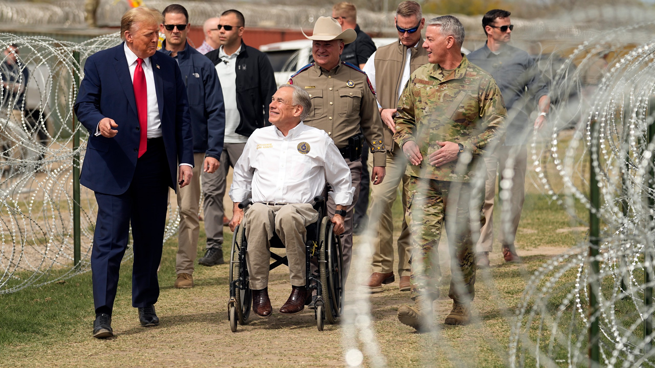 FILE - Republican presidential candidate former President Donald Trump talks with Texas Gov. Greg Abbott during a visit to the U.S.-Mexico border, Feb. 29, 2024, in Eagle Pass, Texas. (AP Photo/Eric Gay, File)