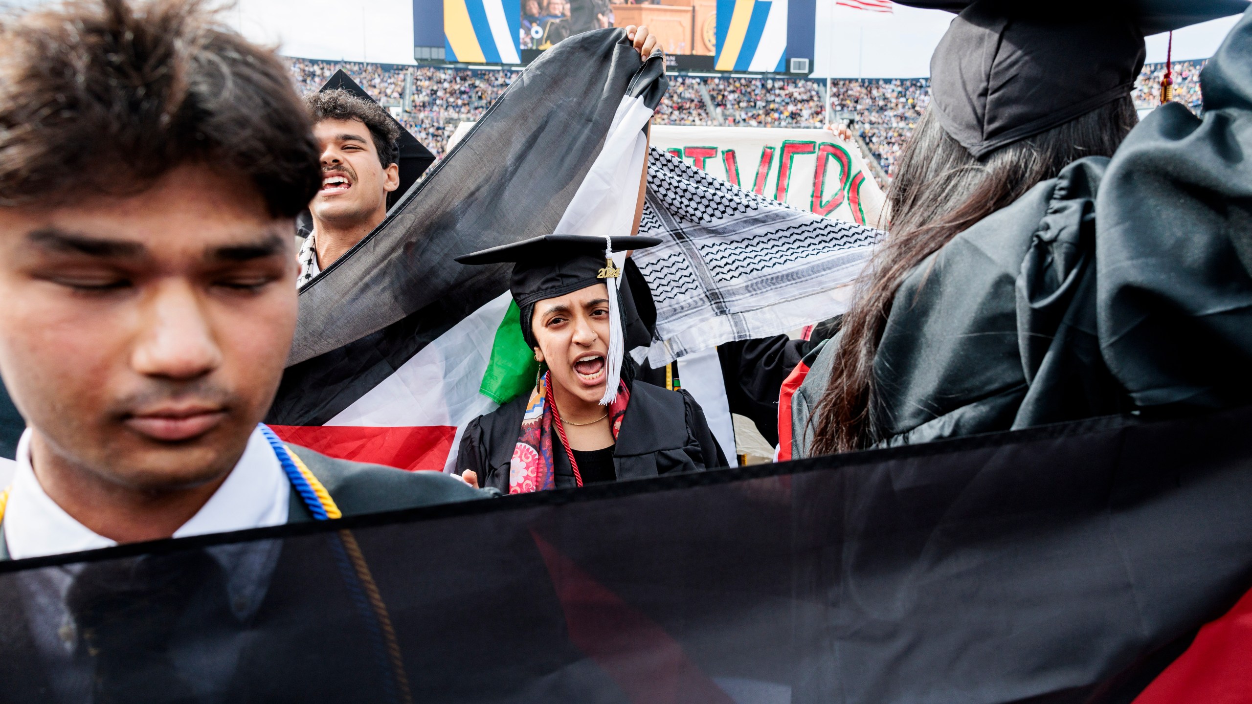 Pro-Palestinian protesters demonstrate during the University of Michigan's Spring 2024 Commencement Ceremony at Michigan Stadium in Ann Arbor, Mich., on Saturday, May 4, 2024. (Jacob Hamilton/Ann Arbor News via AP)