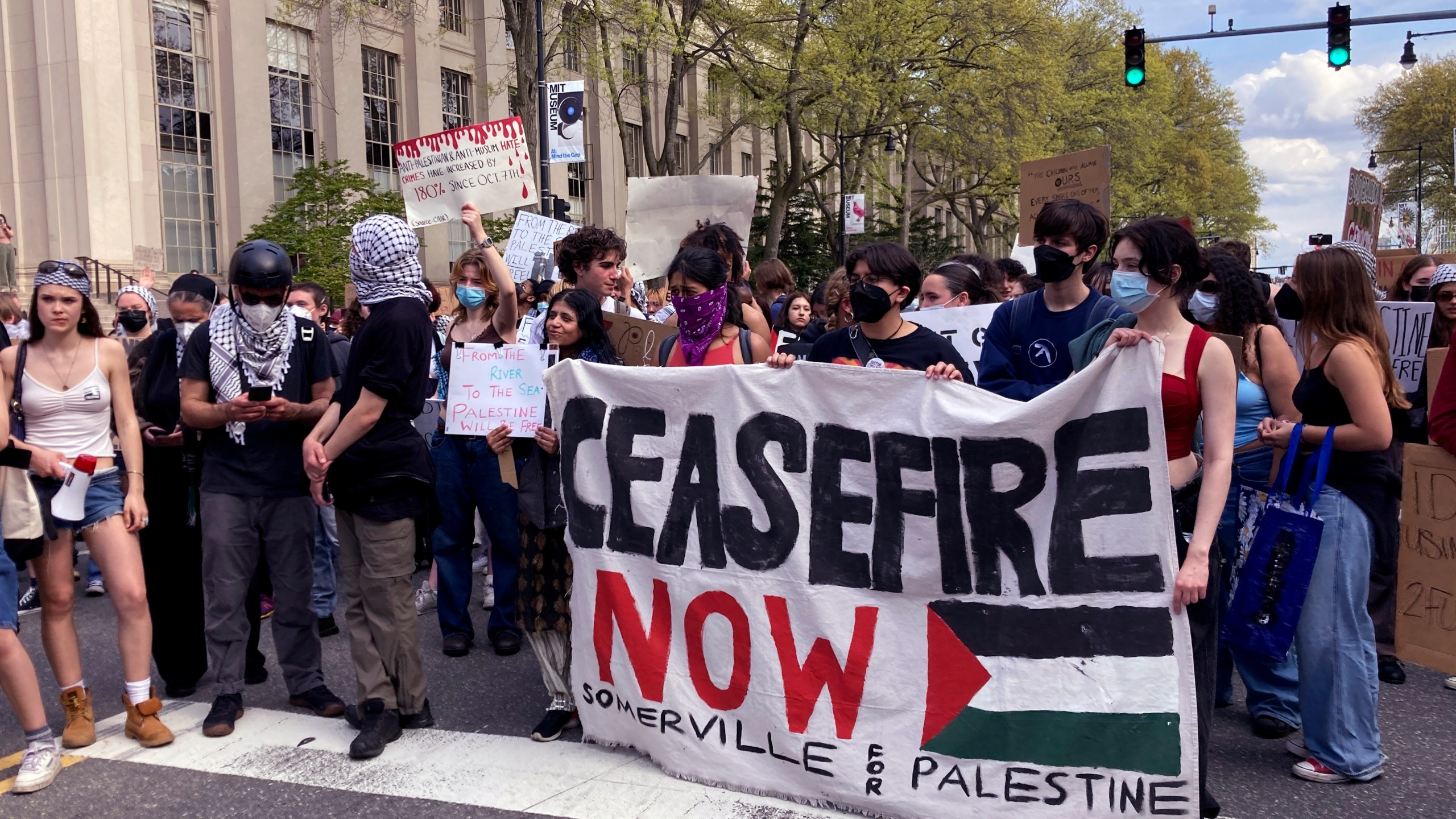 Pro-Palestinian protestors stand on Massachusetts Avenue near a student encampment on the campus of the Massachusetts Institute of Technology, after a 2:30pm deadline passed to leave the encampment, Monday May 6, 2024, in Cambridge, Mass. (AP Photo/Steve LeBlanc)