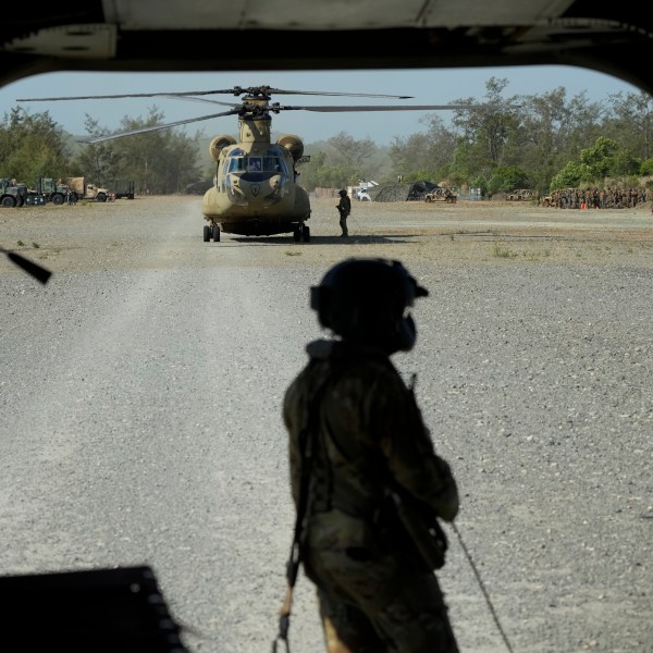 U.S. trooper prepares their U.S. Army CH-47 at Paredes Air Station at Pasuquin, Ilocos Norte province during a joint military exercise in northern Philippines on Monday, May 6, 2024. American and Filipino marines held annual combat-readiness exercises called Balikatan, Tagalog for shoulder-to-shoulder, in a show of allied military readiness in the Philippines' northernmost town facing southern Taiwan. (AP Photo/Aaron Favila)