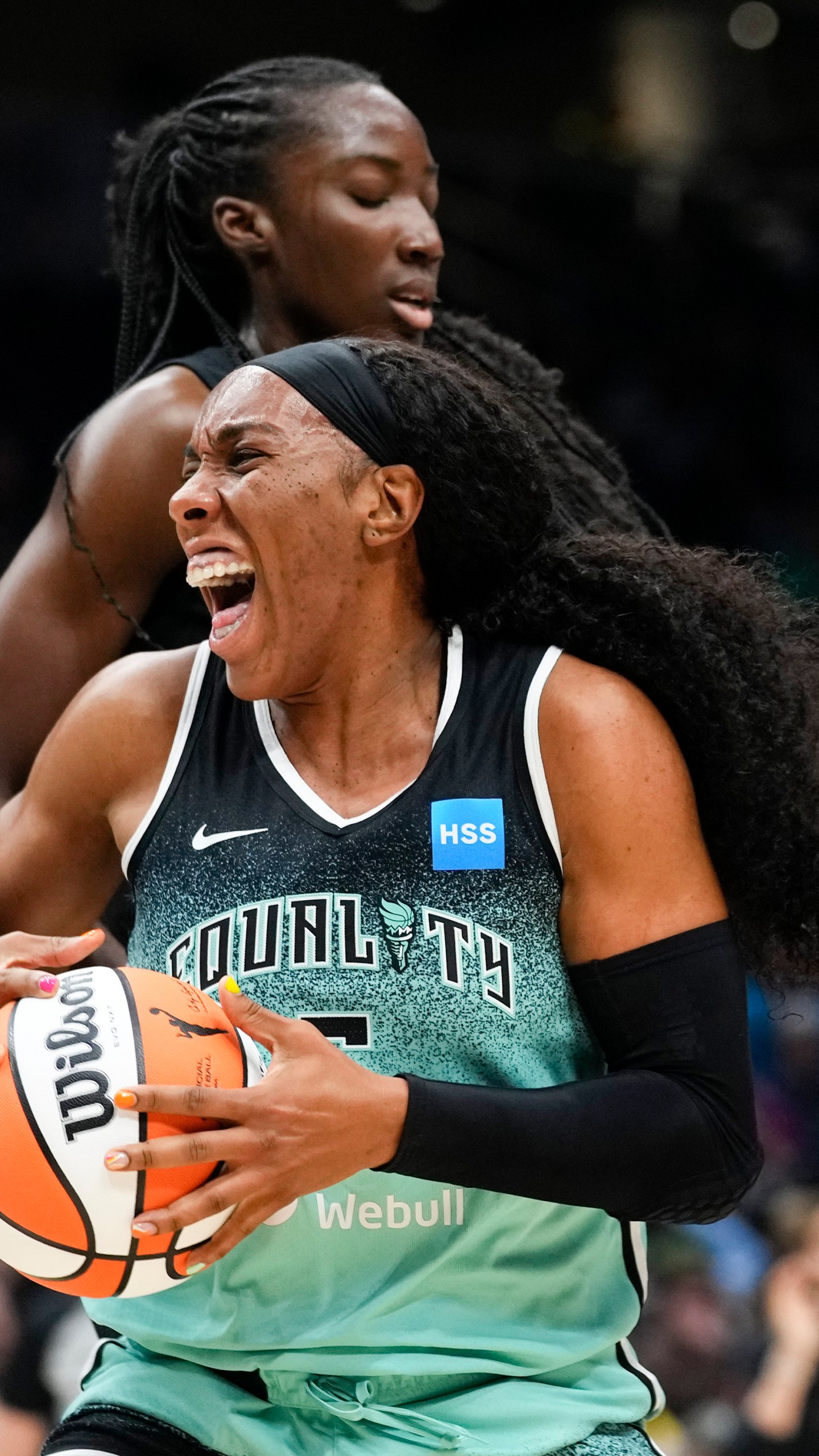 FILE - New York Liberty forward Kayla Thornton, bottom, reacts in front of Seattle Storm center Ezi Magbegor, top, as a jump ball is called during the first half of a WNBA basketball game May 30, 2023, in Seattle. Two WNBA players were among a dozen Americans that opted to play in Russia this past offseason, a decision Thornton said raised a few eyebrows following Brittney Griner’s incarceration in 2022. (AP Photo/Lindsey Wasson, File)