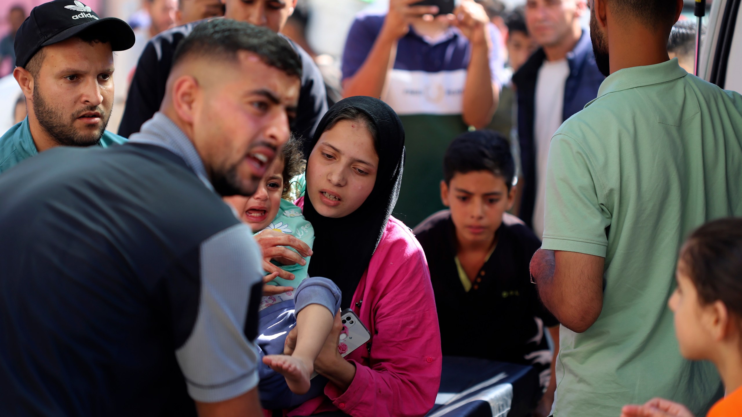 A Palestinian child is brought to the Kuwaiti Hospital after being wounded in the Israeli bombardment of the Gaza Strip, in Rafah refugee camp, southern Gaza, Tuesday, May 7, 2024. (AP Photo/Ramez Habboub)