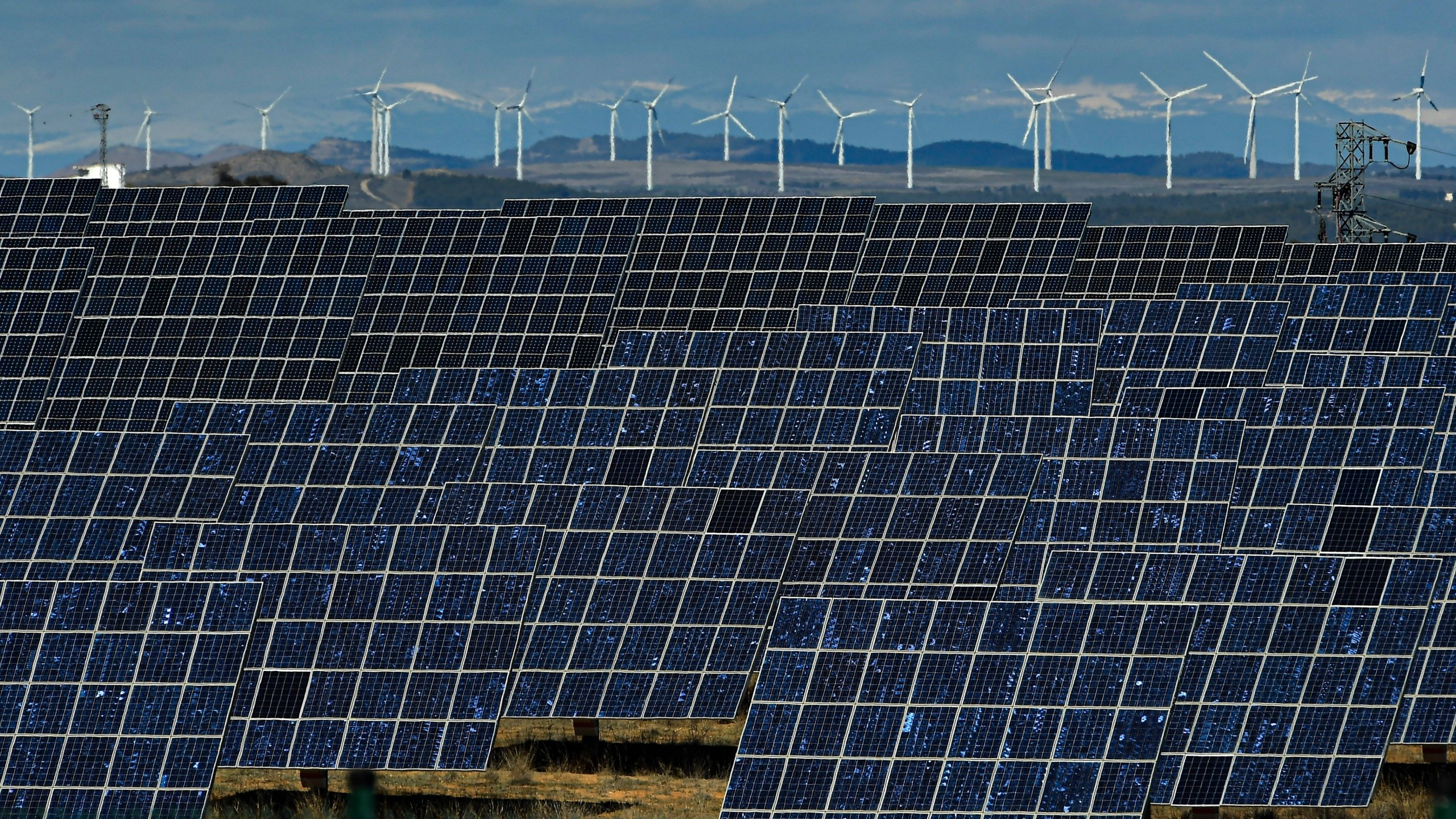 FILE - Solar panels work near the small town of Milagro, Navarra Province, northern Spain, Feb. 24, 2023. Billions of people are using different kinds of energy each day and 2023 was a record-breaking year for renewable energy sources, according to a report published Wednesday, May 8, 2024, by Ember, a think tank based in London. (AP Photo/Alvaro Barrientos, File)