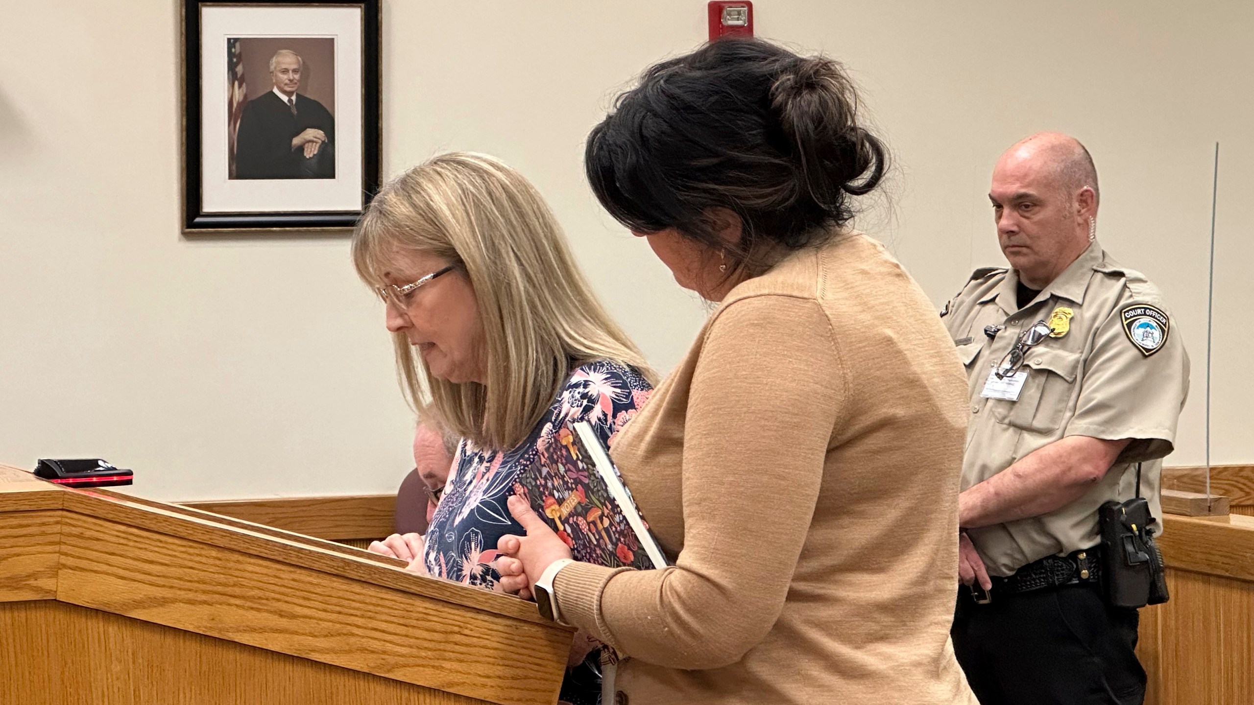 Penny Laperriere, left, speaks to a judge in Howell, Mich., Friday, May 10, 2024, about the death of her husband from a tainted steroid injection in 2012. Specialty pharmacy executive Barry Cadden was sentenced to at least 10 years in prison for the deaths of 11 people who were injected with tainted pain medication, part of a meningitis outbreak that affected hundreds across the U.S. in 2012. (AP Photo/Ed White)