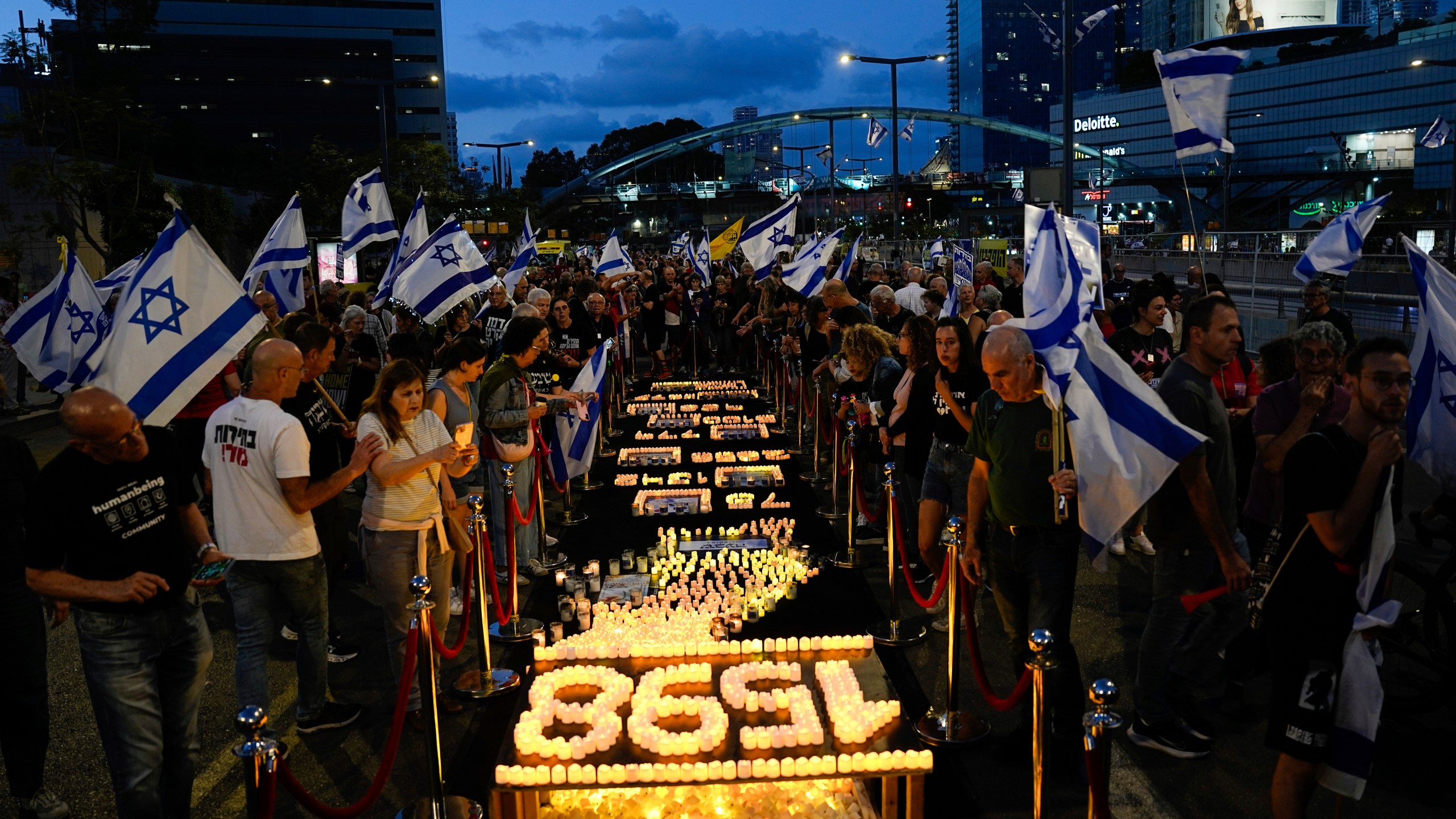 People protest against Israeli Prime Minister Benjamin Netanyahu's government and call for the release of hostages held in the Gaza Strip by the Hamas militant group in Tel Aviv, Israel, Saturday, May 11, 2024. (AP Photo/Ariel Schalit)