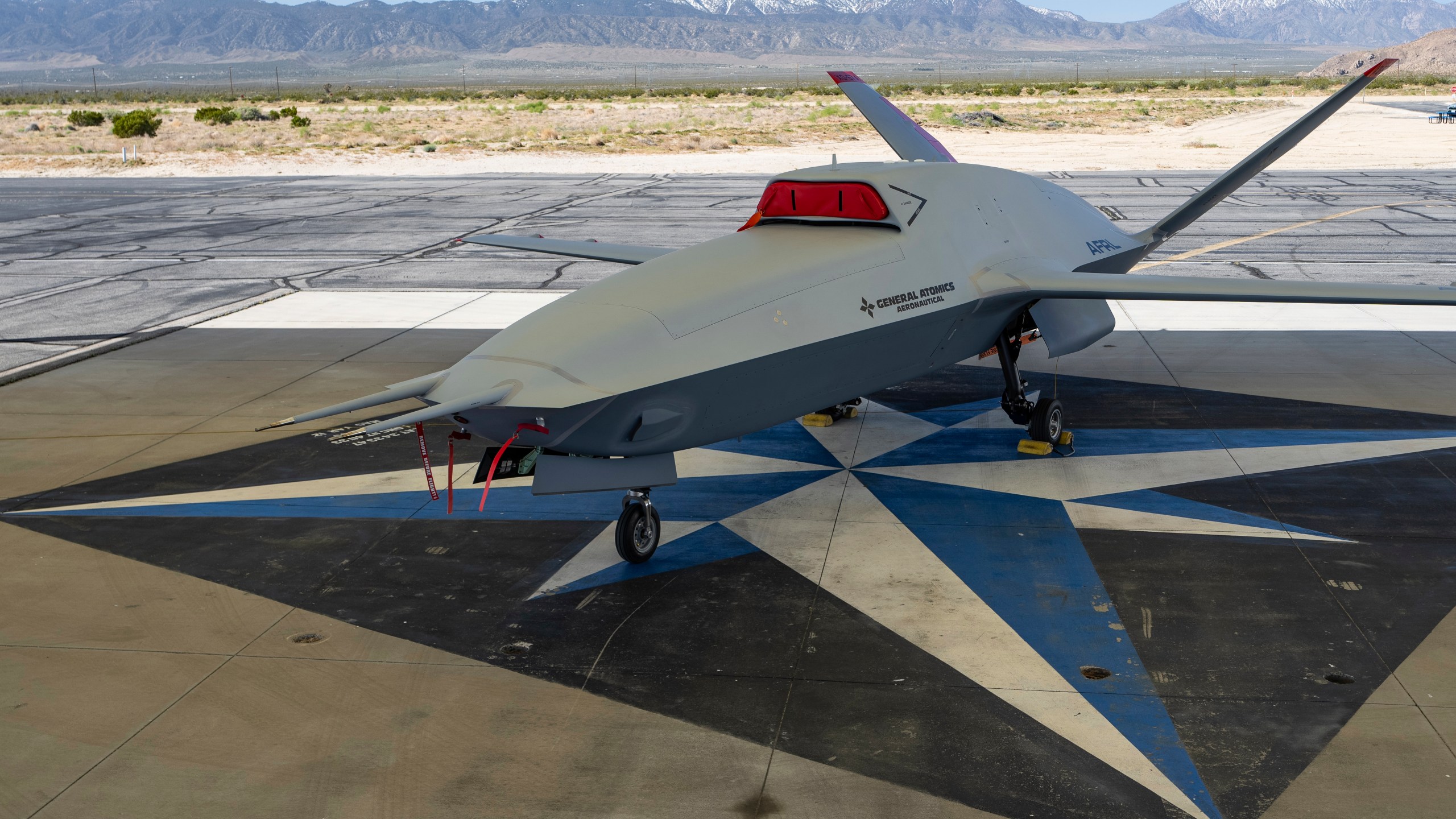 FILE - The XQ-67A Off-Board Sensing Station unmanned aerial vehicle, one prototype of the future AI drone fleet developed under the USAF's Air Force Research Laboratory, is displayed at General Atomics' test facility at Gray Butte in Palmdale, Calif., on Wednesday, May 1, 2024. (AP Photo/Damian Dovarganes, File)