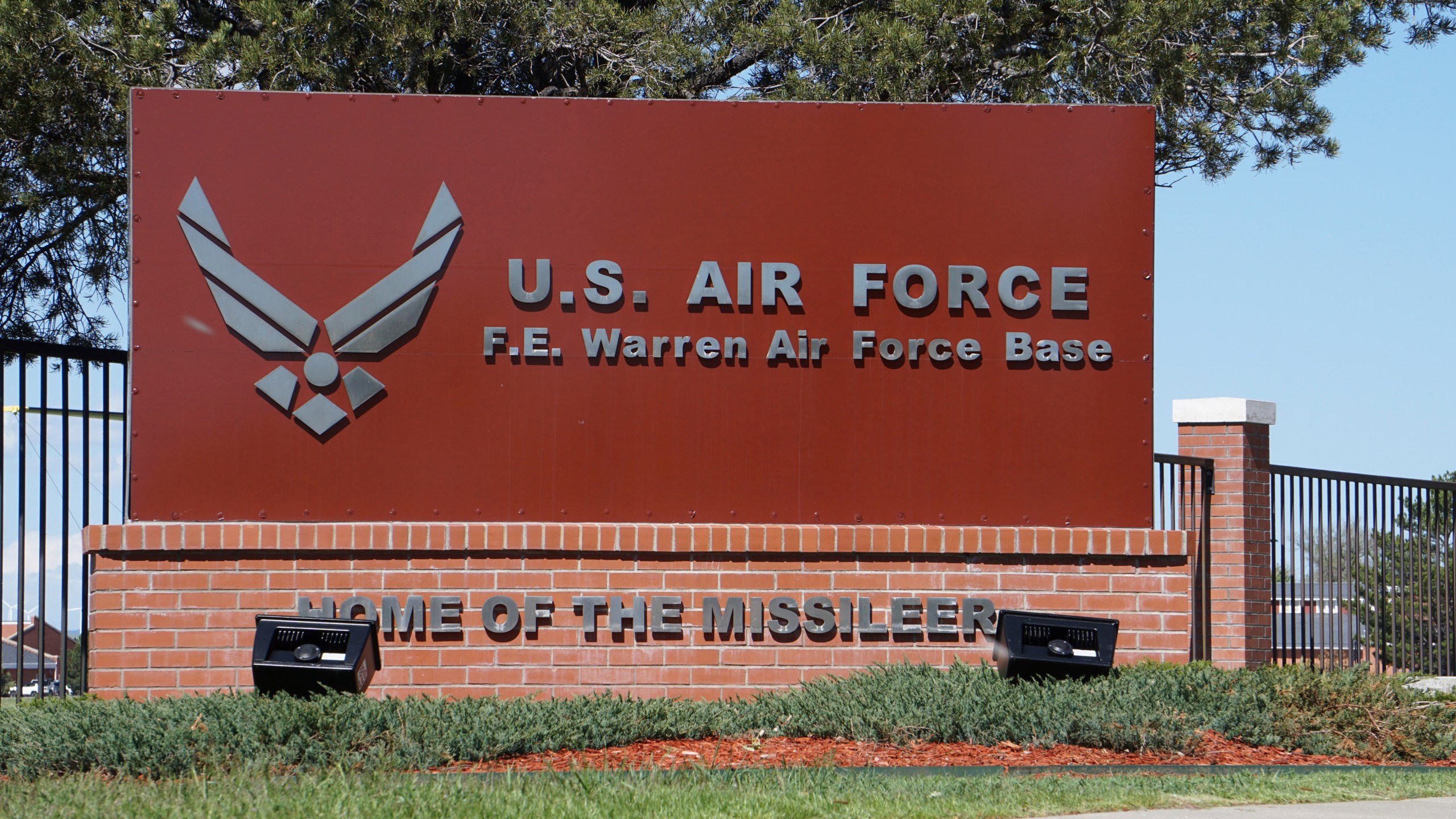 FILE - The entrance to F.E. Warren Air Force Base is pictured May 24, 2018, in Cheyenne, Wyo. President Joe Biden on Monday, May 13, 2024, issued an order blocking a Chinese-backed cryptocurrency mining firm from owning land near the Wyoming nuclear missile base. The order forces the divestment of property operated as a crypto mining facility near the base. (AP Photo/Mead Gruver, File)