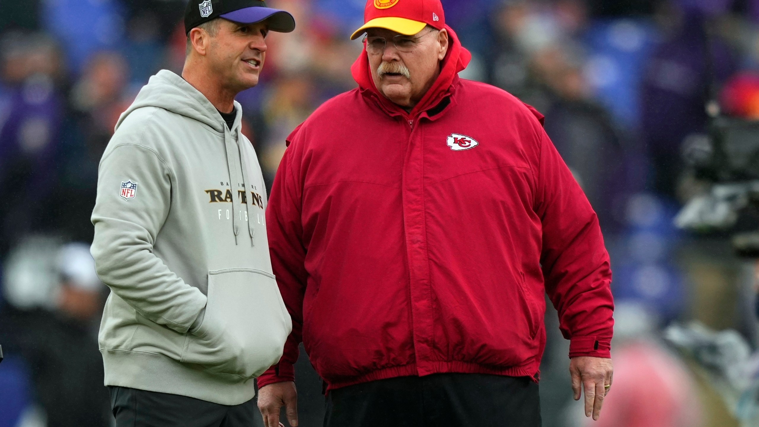 FILE - Kansas City Chiefs head coach Andy Reid and Baltimore Ravens head coach John Harbaugh talk before the AFC Championship NFL football game, Sunday, Jan. 28, 2024, in Baltimore. The NFL announced Monday, May 13, 2024, that the Super Bowl champion Kansas City Chiefs will open the season at home against the Baltimore Ravens on Thursday, Sept. 5. The game is a rematch of the AFC championship game in January, which the Chiefs won 17-10 in Baltimore.(AP Photo/Matt Slocum, File)