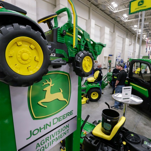 John Deere tractors on display for sale.