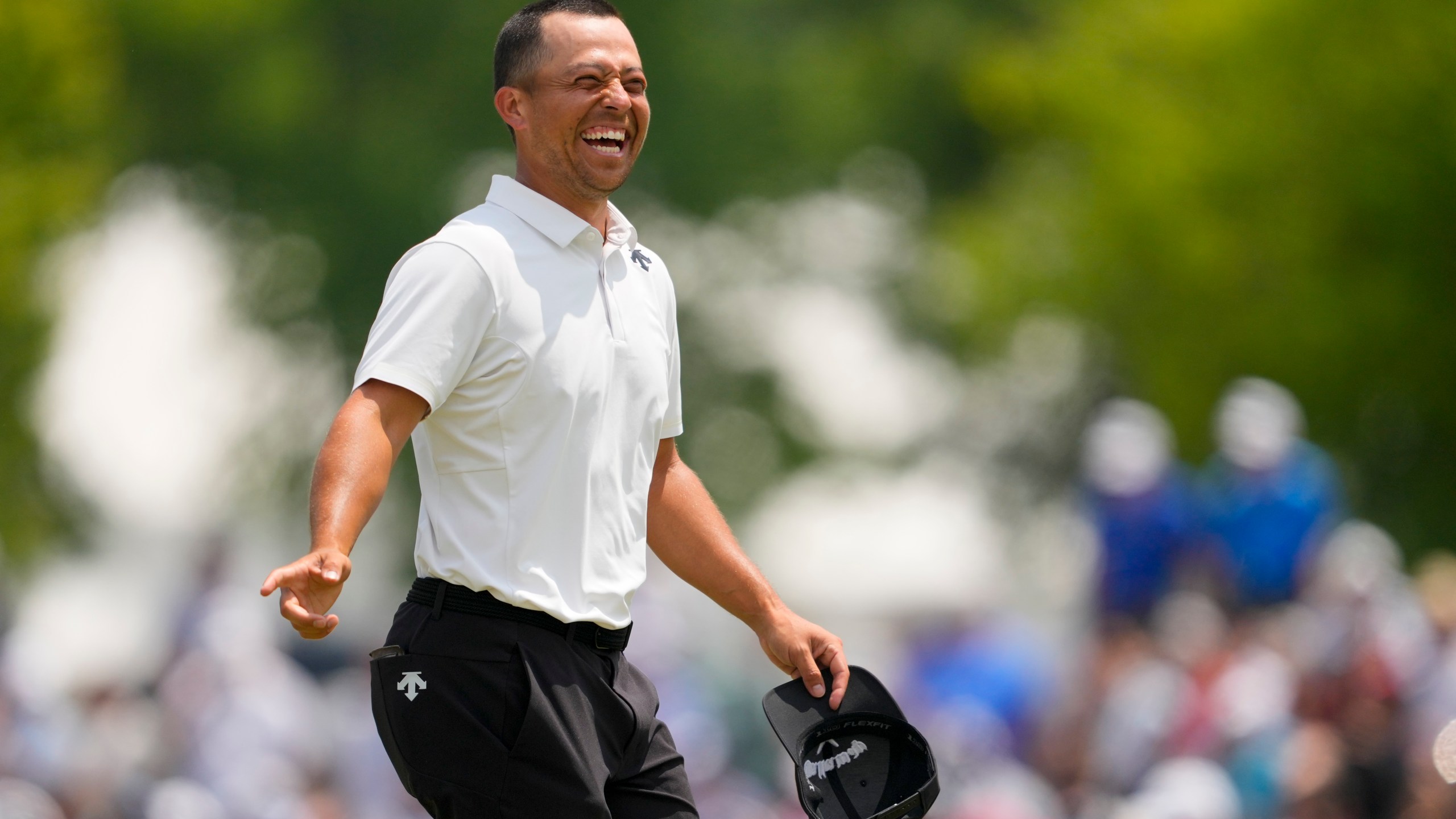 Xander Schauffele smiles after the first round of the PGA Championship golf tournament at the Valhalla Golf Club, Thursday, May 16, 2024, in Louisville, Ky. (AP Photo/Matt York)