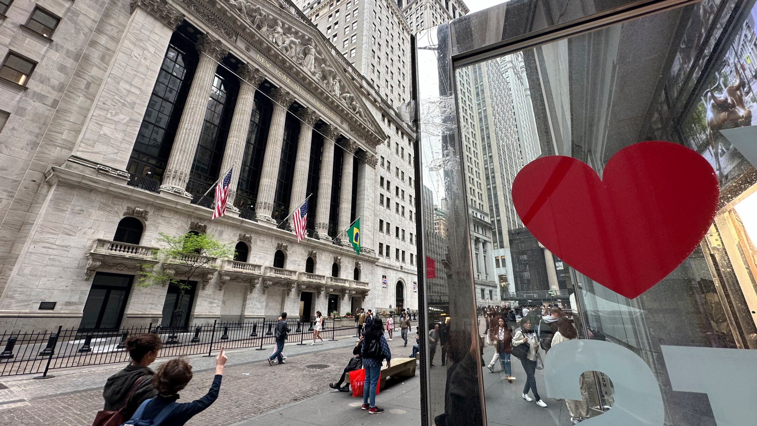 A heart is displayed on the door of a gift shop across from the New York Stock Exchange on Thursday, May 16, 2024, in New York. The Dow Jones Industrial Average briefly topped the 40,000 level on Thursday for the first time but ended 0.1% lower. (AP Photo/Peter Morgan)