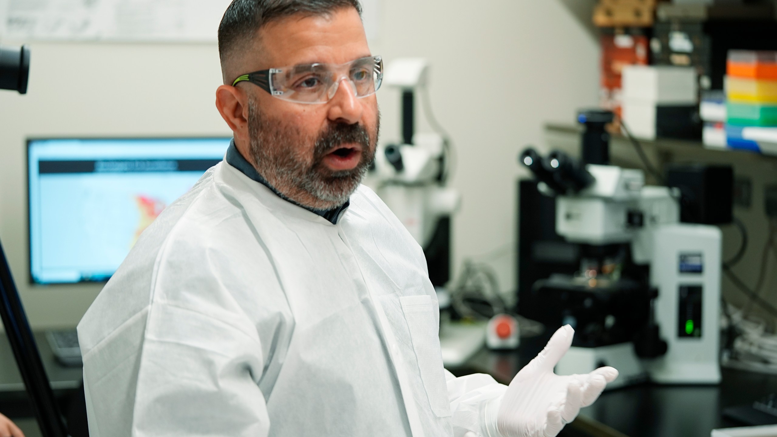 Researcher Erik Foster talks in his laboratory about ticks during a tour of the Center for Disease Control laboratory Thursday, April 4, 2024, in Fort Collins, Colo. (AP Photo/David Zalubowski)