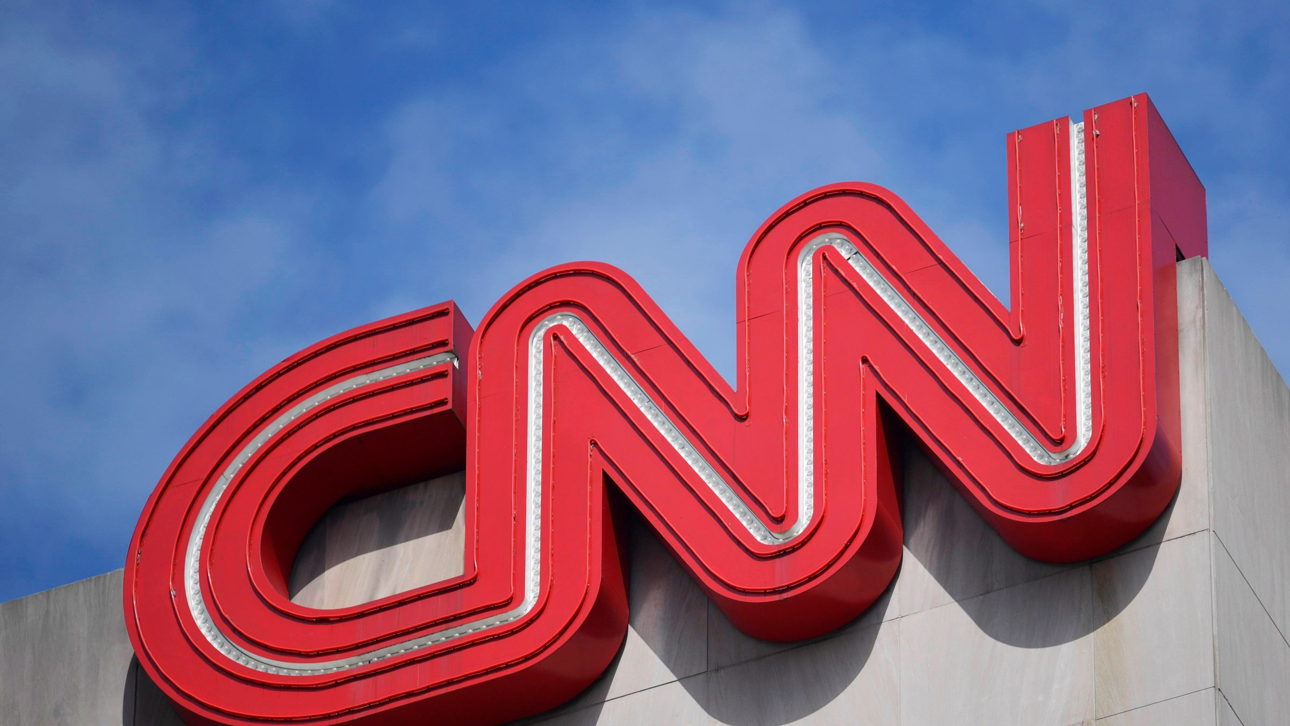 Signage hangs at CNN center, April 21, 2022, in Atlanta.