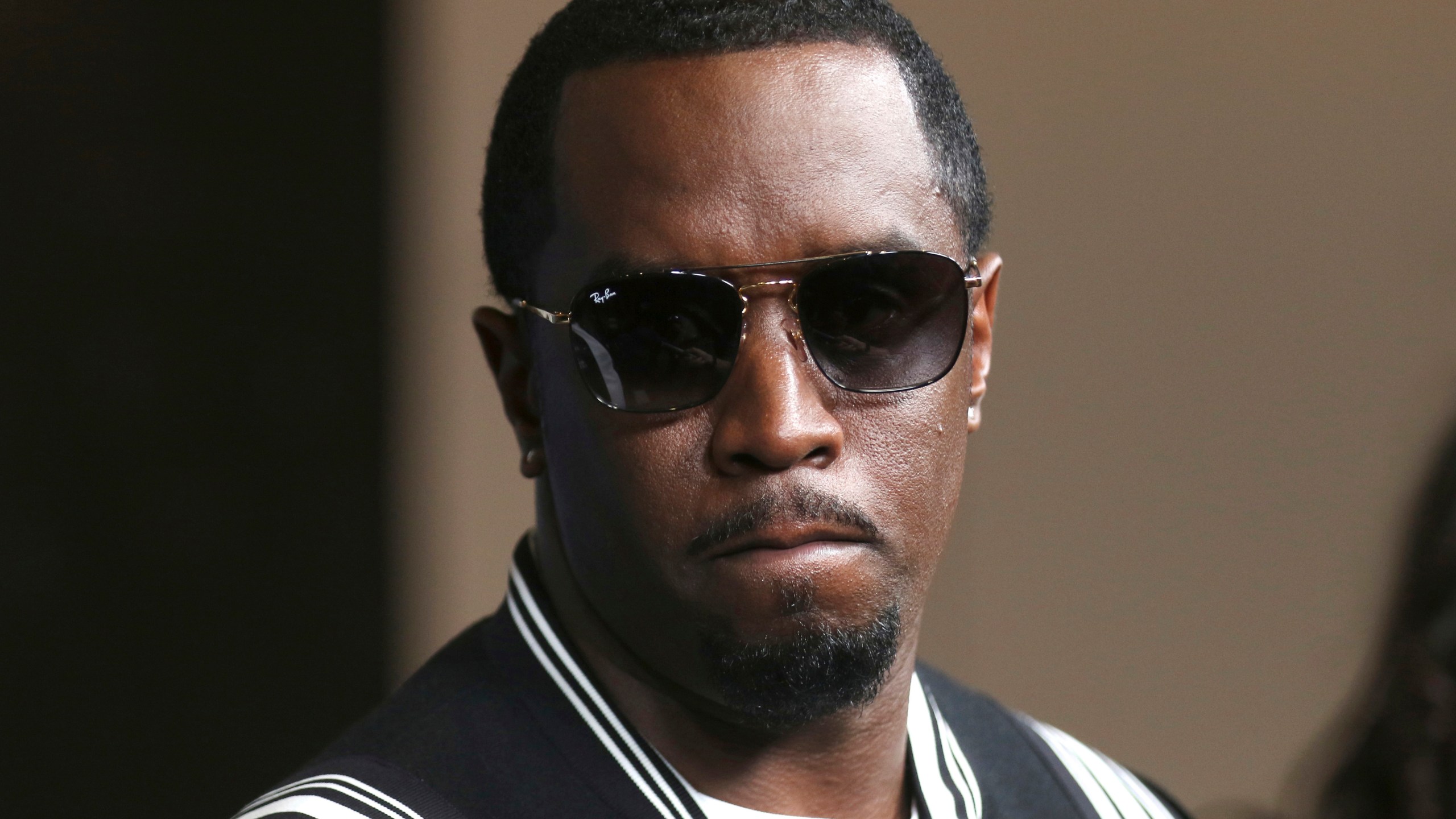 FILE - Sean "Diddy" Combs arrives at the LA Premiere of "The Four: Battle For Stardom" at the CBS Radford Studio Center on May 30, 2018, in Los Angeles. Newly released video Friday, May 17, 2024, appears to show Combs beating his former singing protege and girlfriend Cassie in a Los Angeles hotel in 2016. (Photo by Willy Sanjuan/Invision/AP, File)