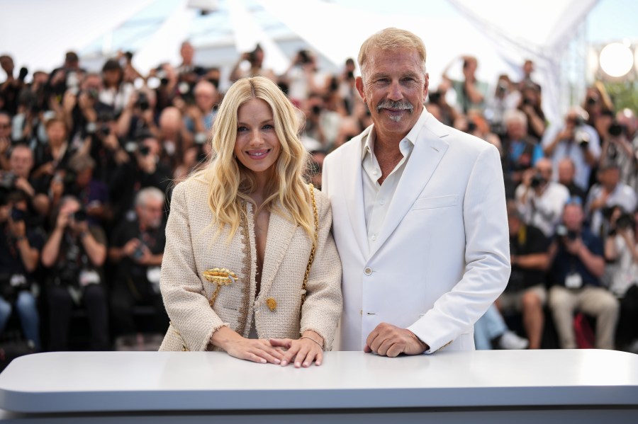 Sienna Miller, left, and Kevin Costner pose for photographers at the photo call for the film 'Horizon: An American Saga' at the 77th international film festival, Cannes, southern France, Sunday, May 19, 2024. (Photo by Scott A Garfitt/Invision/AP)