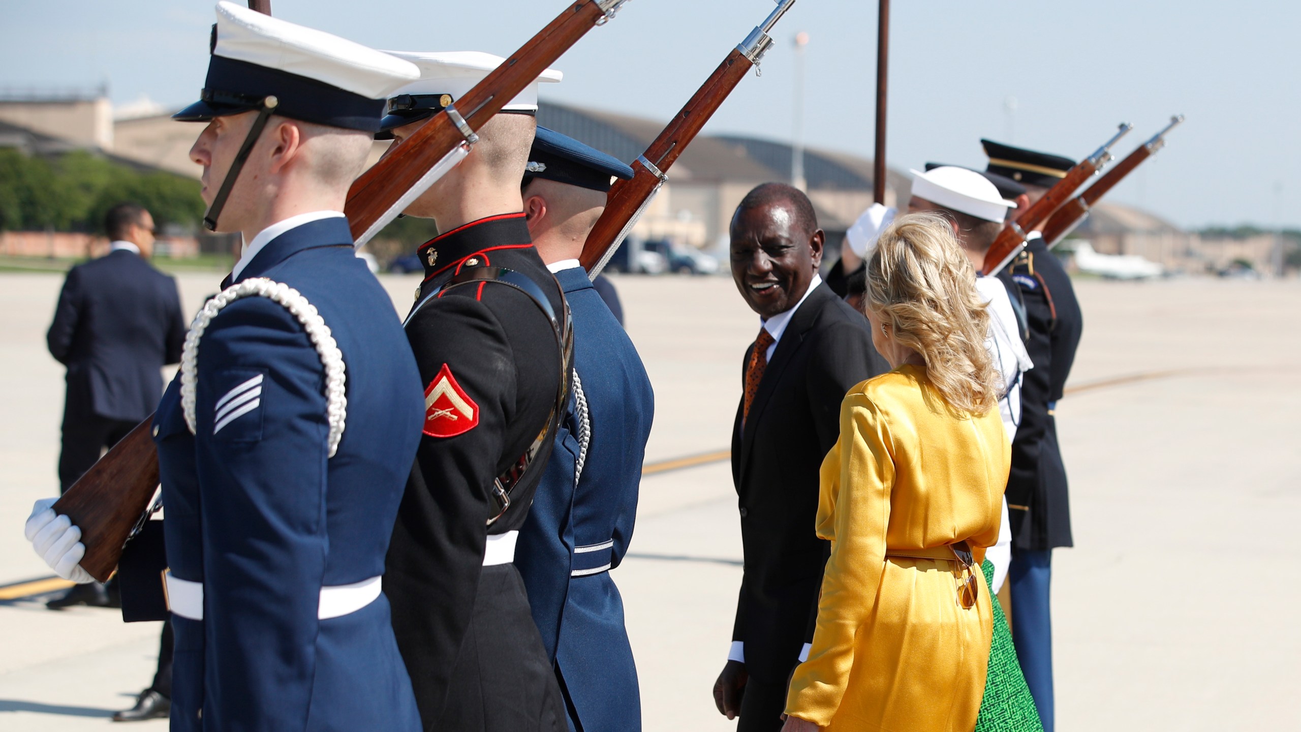 Kenya's President William Ruto, center, and first Lady Jill Biden, right, talk during an arrival ceremony at Andrews Air Force Base, Md., Wednesday, May 22, 2024, during President Ruto's state visit to the United States. (AP Photo/Luis M. Alvarez)