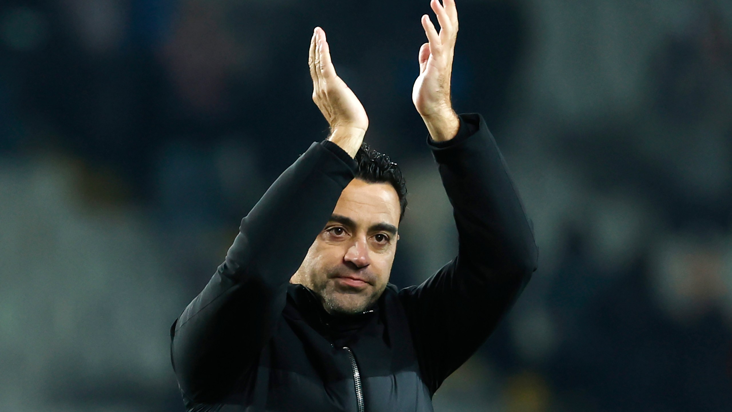 FILE - Barcelona's head coach Xavi Hernandez celebrates after the Spanish La Liga soccer match between Barcelona and Atletico Madrid at the Olimpic Lluis Companys stadium in Barcelona, Spain, on Dec. 3, 2023. Barcelona says coach Xavi Hernandez is leaving the club at the end of the season. The Spanish club made the announcement Friday May 24, 2024 after a meeting between club president Joan Laporta, Xavi and several other senior figures at the team's training ground. (AP Photo/Joan Monfort, File)