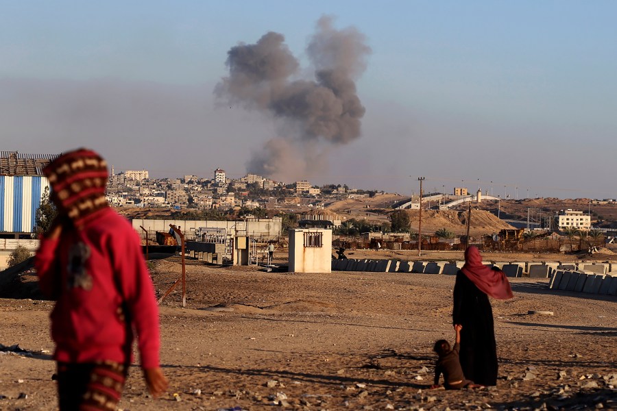 FILE - Smoke rises following an Israeli airstrike on buildings near the separating wall between Egypt and Rafah, southern Gaza Strip, Tuesday, May 7, 2024. An order by the top United Nations court for Israel to halt its military offensive in the southern Gaza city of Rafah deepens its disconnect with the United States. (AP Photo/Ramez Habboub, File)