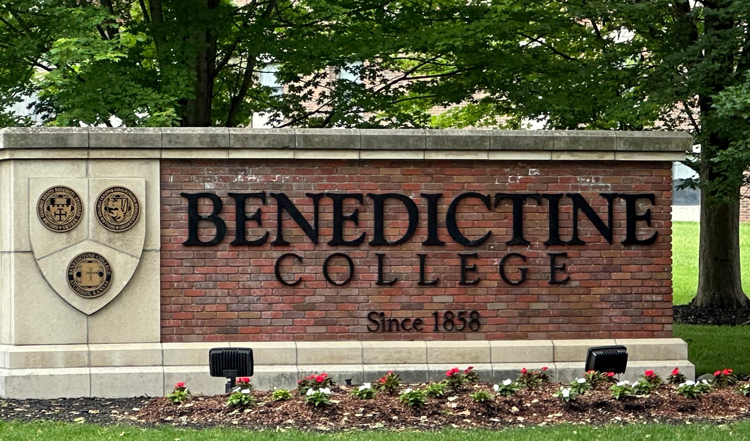 The Benedictine College sign is seen Wednesday, May 15, 2024, in Atchison, Kan., days after Kansas City Chiefs kicker Harrison Butker gave a commencement speech that has been gaining attention. Butker's speech has raised some eyebrows with his proclamations of conservative politics and Catholicism, but he received a standing ovation from graduates and other attendees of the commencement ceremony on Saturday, May 11. (AP Photo/Nick Ingram)