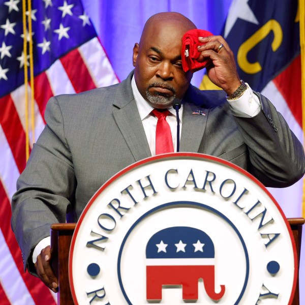 Lt. Gov. Mark Robinson wipes perspiration from his head as he speaks at the North Carolina GOP Convention.