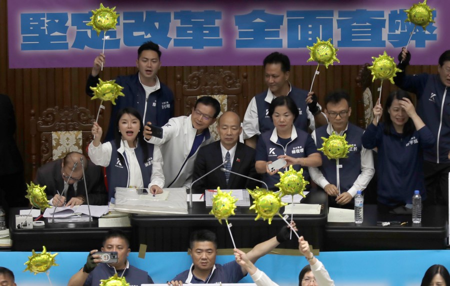 Supporters for both ruling and opposition parties demonstrate at the legislative chamber building in Taipei, Taiwan, Tuesday, May 28, 2024. (AP Photo/Chiang Ying-ying)