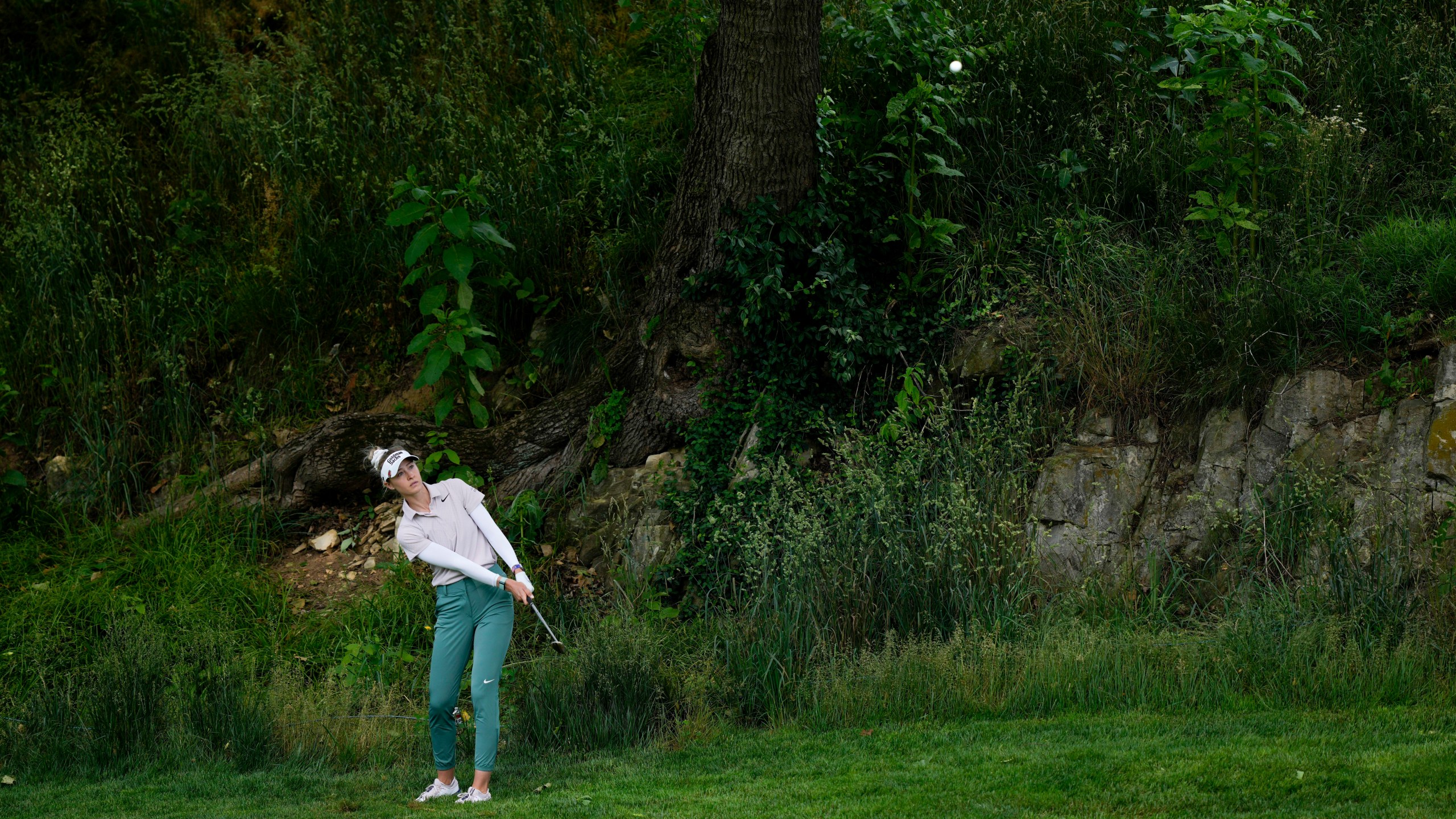 Nelly Korda hits off the rough on the fourth hole during the first round of the U.S. Women's Open golf tournament at Lancaster Country Club, Thursday, May 30, 2024, in Lancaster, Pa. (AP Photo/Matt Rourke)