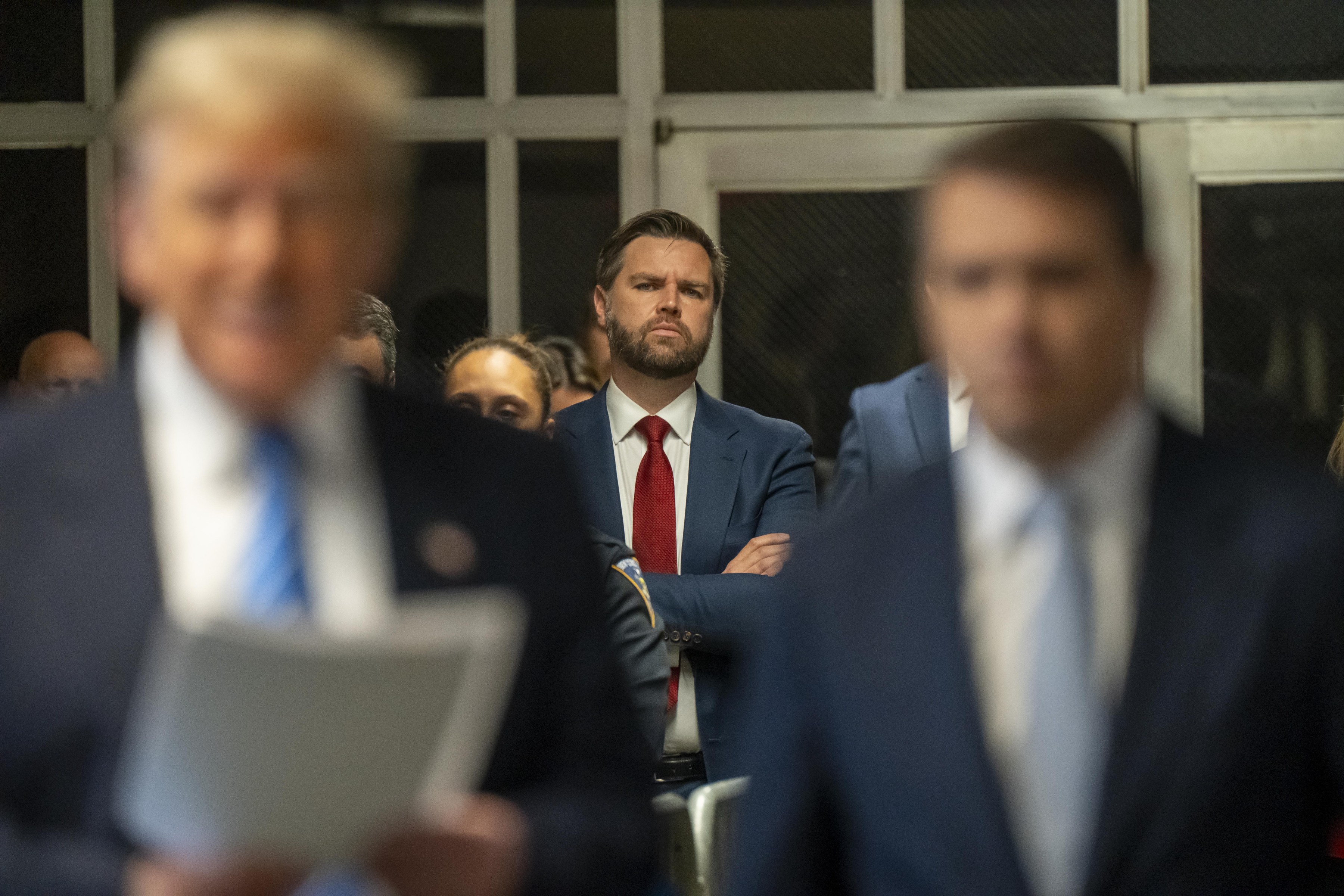 Senator JD Vance, a Republican from Ohio watches as Donald Trump speaks to the media at Manhattan criminal court May 13, 2024.