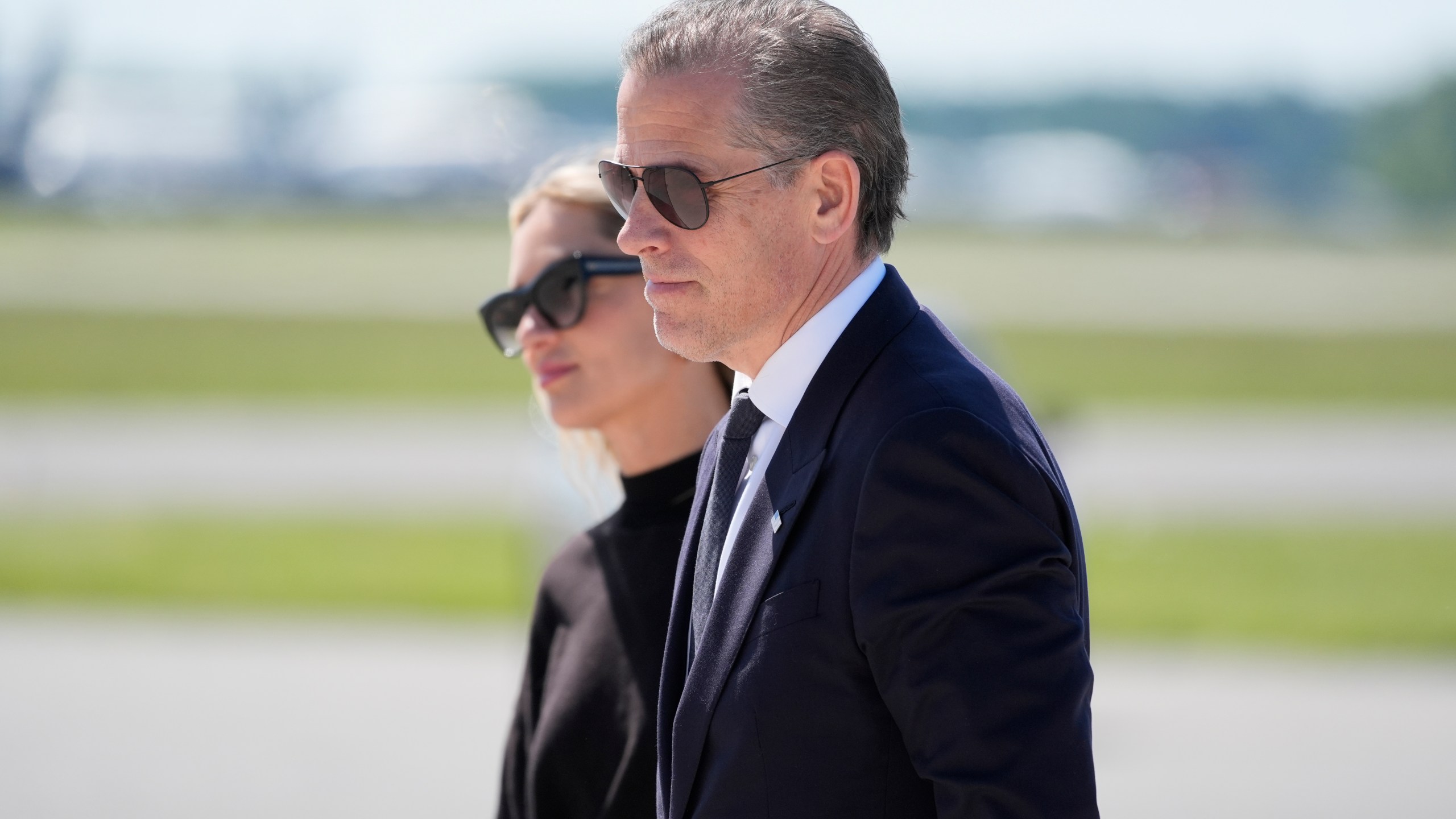 Hunter Biden, President Joe Biden's son, right, walks with his wife Melissa Cohen Biden, to board Air Force One at Dover Air Force Base, Del., Friday, May 31, 2024. President Biden is returning to Washington. (AP Photo/Alex Brandon)