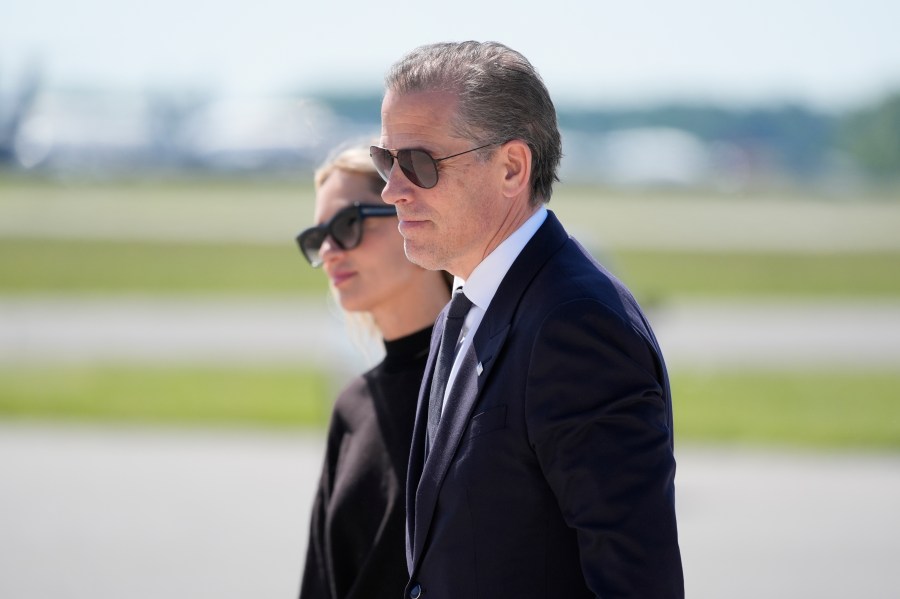 Hunter Biden, President Joe Biden's son, right, walks with his wife Melissa Cohen Biden, to board Air Force One at Dover Air Force Base, Del., Friday, May 31, 2024. President Biden is returning to Washington. (AP Photo/Alex Brandon)