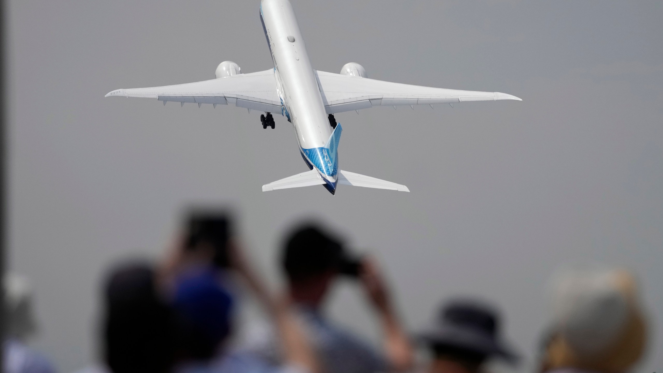 FILE - A Boeing 777X plane takes off at the Farnborough Air Show fair in Farnborough, England, on July 18, 2022. The cost of your next flight is likely to go up. That's the word from the International Air Transport Association, which held its annual meeting Monday June 3, 2024 in Dubai, home to the long-haul carrier Emirates. (AP Photo/Frank Augstein, File)