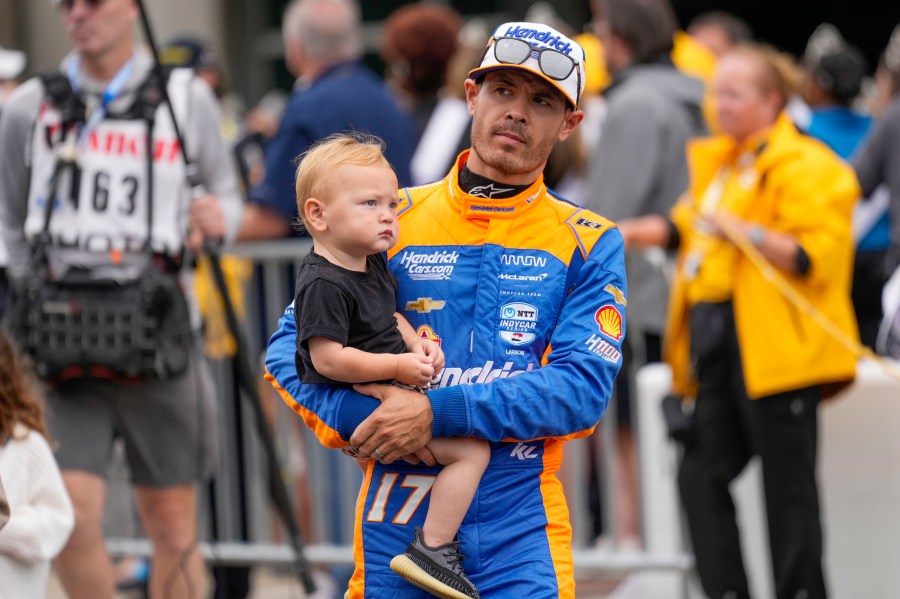 Kyle Larson walks out during driver introductions before the Indianapolis 500 auto race at Indianapolis Motor Speedway in Indianapolis, Sunday, May 26, 2024. (AP Photo/AJ Mast)