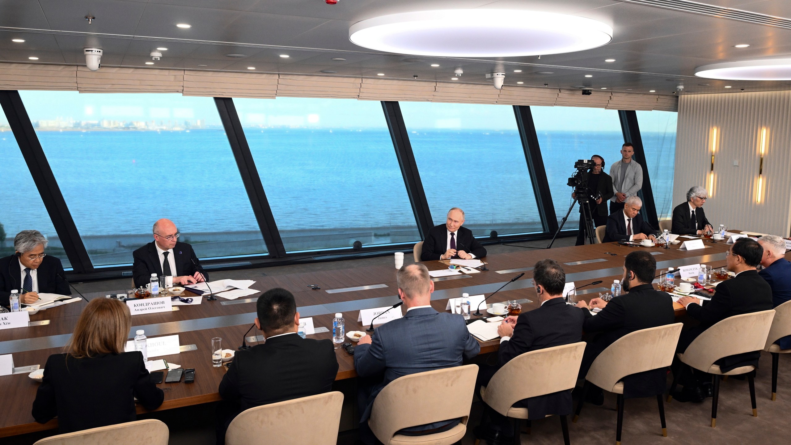 Russian President Vladimir Putin, center right, speaks to senior news leaders of international news agencies on the sidelines of the St. Petersburg International Economic Forum at the Lakhta Center skyscraper, the headquarters of Russian gas monopoly Gazprom in St. Petersburg, Russia, on Wednesday, June 5, 2024. (Vladimir Astapkovich, Sputnik, Kremlin Pool Photo via AP)