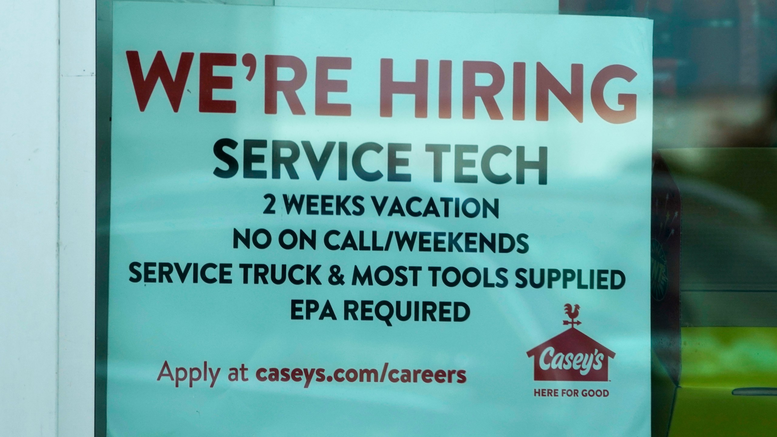 A hiring sign is displayed at a gas station in Vernon Hills, Ill., Monday, June 3, 2024. On Thursday, June 6, 2024, the Labor Department reports on the number of people who applied for unemployment benefits last week. (AP Photo/Nam Y. Huh)