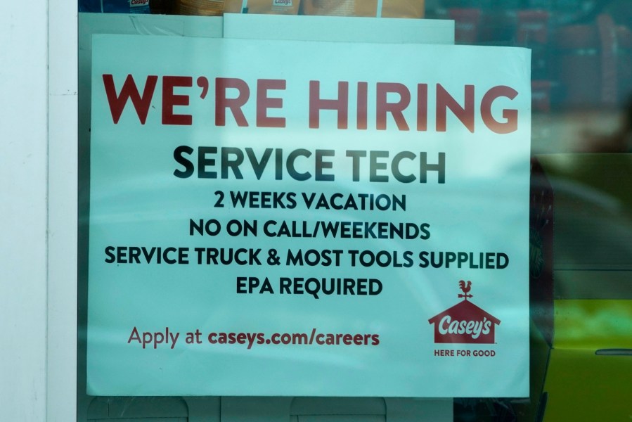 A hiring sign is displayed at a gas station in Vernon Hills, Ill., Monday, June 3, 2024. On Thursday, June 6, 2024, the Labor Department reports on the number of people who applied for unemployment benefits last week. (AP Photo/Nam Y. Huh)