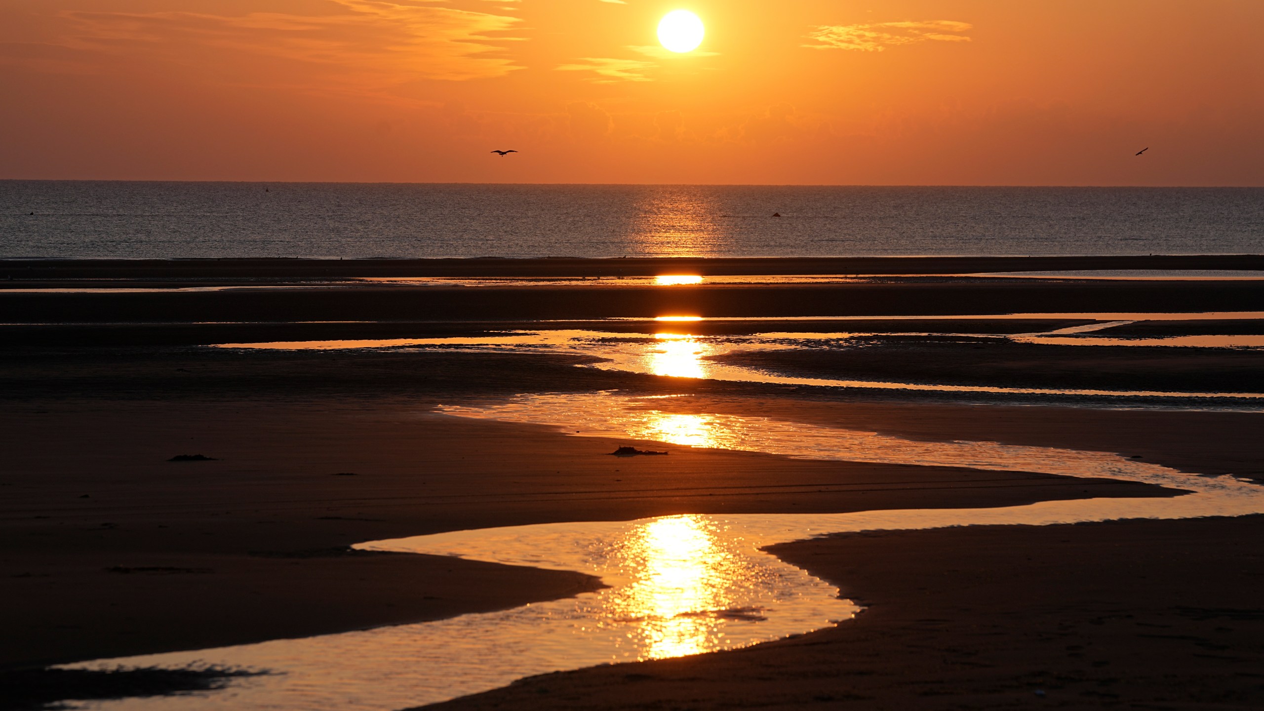 Sun rises over Omaha Beach near Colleville-sur-Mer Normandy, Thursday, June 6, 2024. World War II veterans from across the United States as well as Britain and Canada are in Normandy this week to mark 80 years since the D-Day landings that helped lead to Hitler's defeat. (AP Photo/Laurent Cipriani)