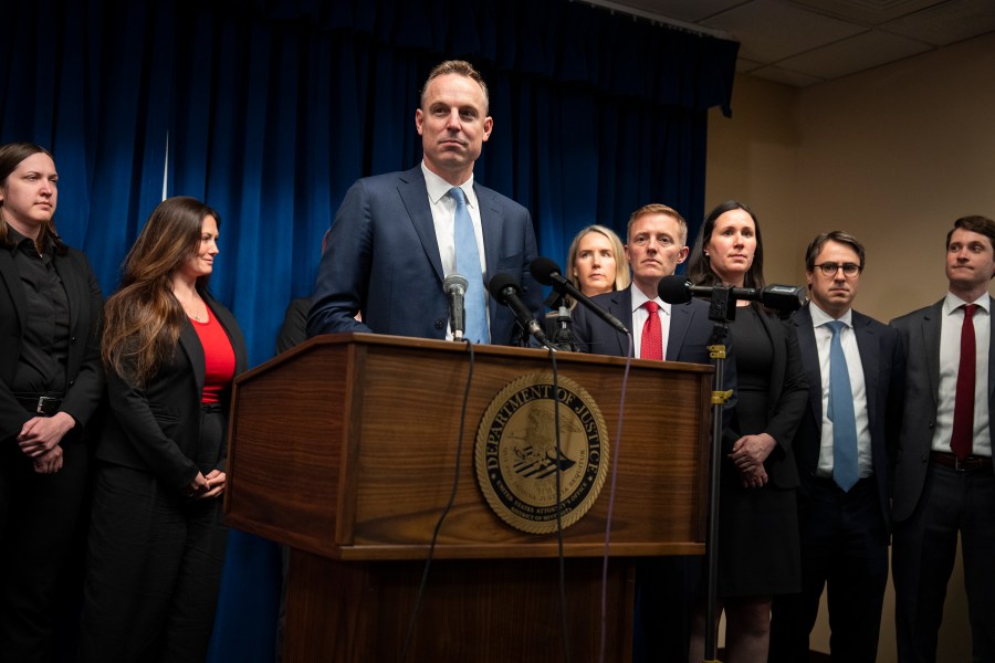 Assistant U.S. Attorney Joe Thompson, surrounded by the prosecution's trial team, speaks during a news conference after the verdict was read in the first Feeding Our Future case at the federal courthouse in Minneapolis, Friday, June 7, 2024. A jury convicted five Minnesota residents and acquitted two others Friday for their roles in a scheme to steal more than $40 million that was supposed to feed children during the coronavirus pandemic. (Leila Navadi/Star Tribune via AP)